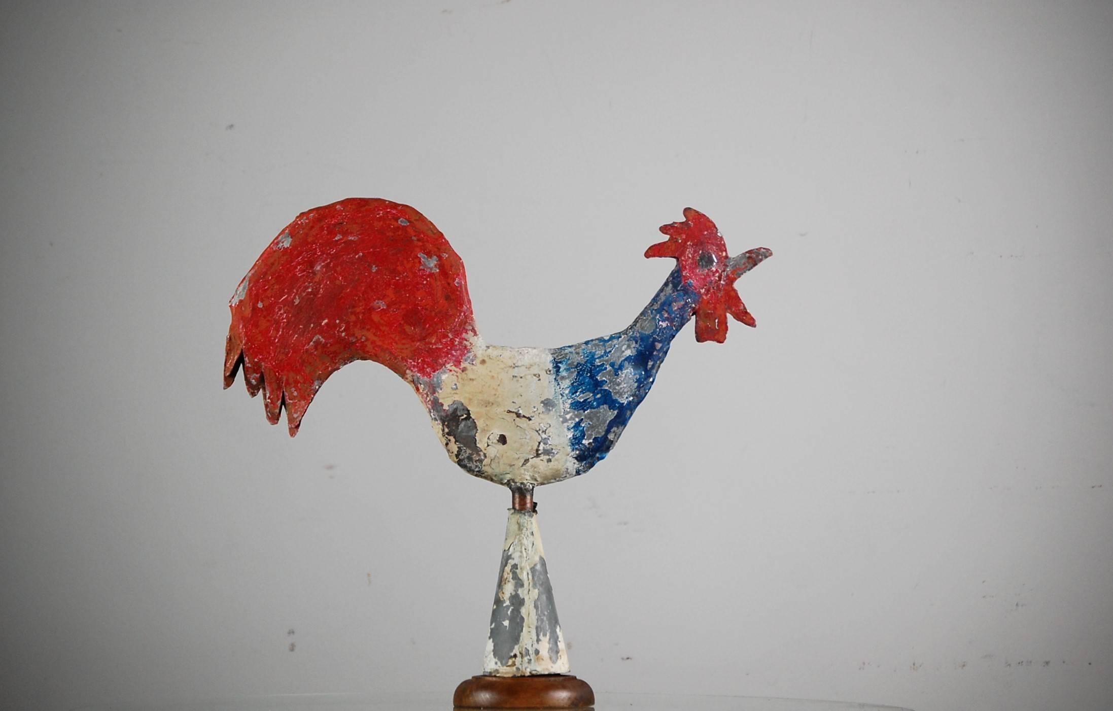 Early 20th century diminutive full bodied zinc cockerel weathervane. Naïve construction and charming distressed paint, the patriotic color of the tricolor or French flag were often daubed on the cockerels (French national symbol) for patriotic