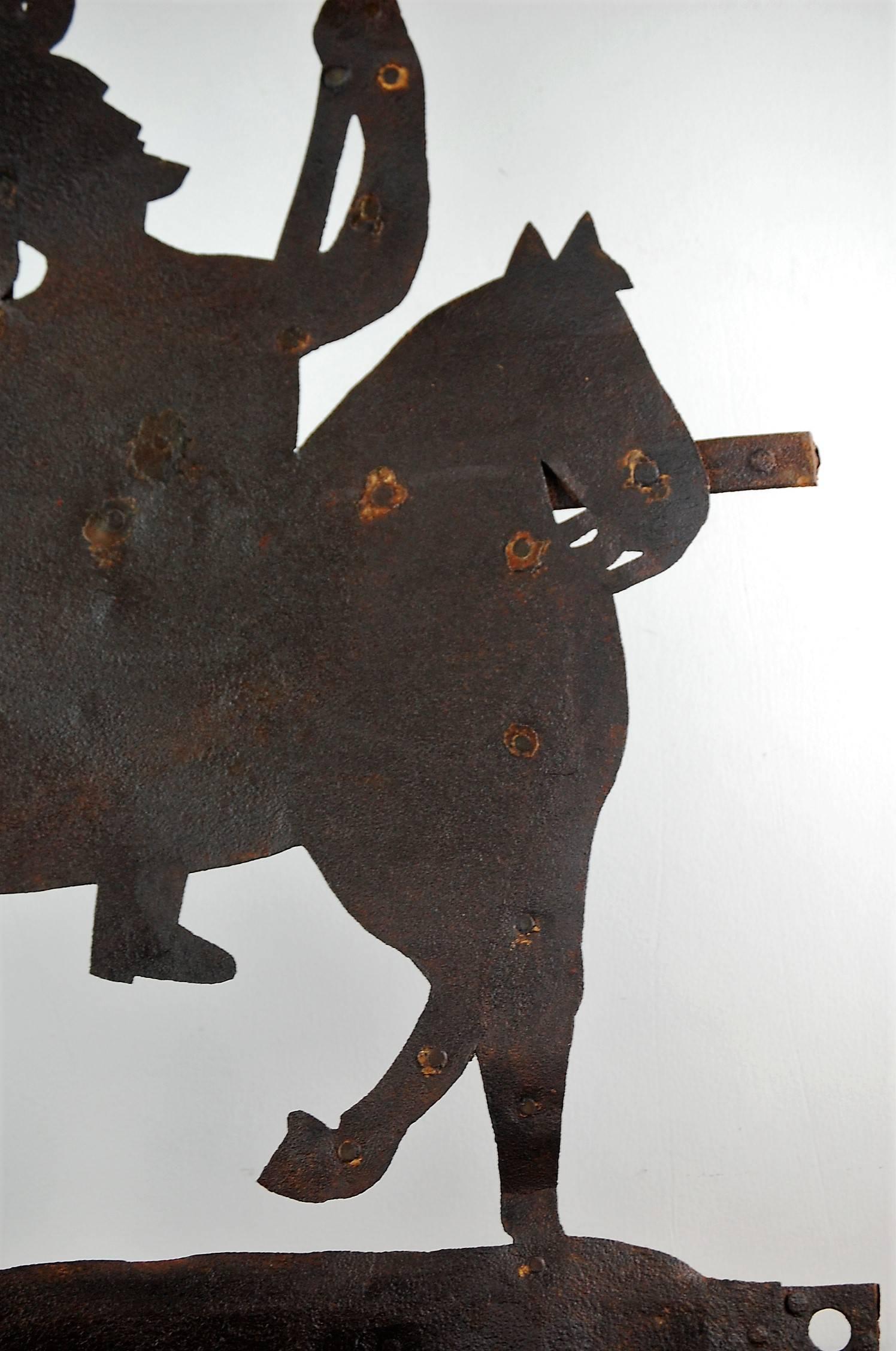 Mid-19th century Silhouette military outfitters trade sign, sheet metal, naïve depiction of the Cavalryman drawing his sword, supporting strap metal to the rear.