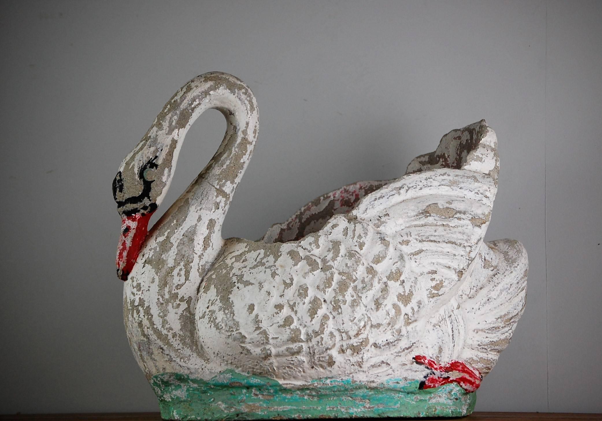 20th century painted cast concrete swan planter in elegant swimming pose, heavily distressed paintwork, France, circa 1960.