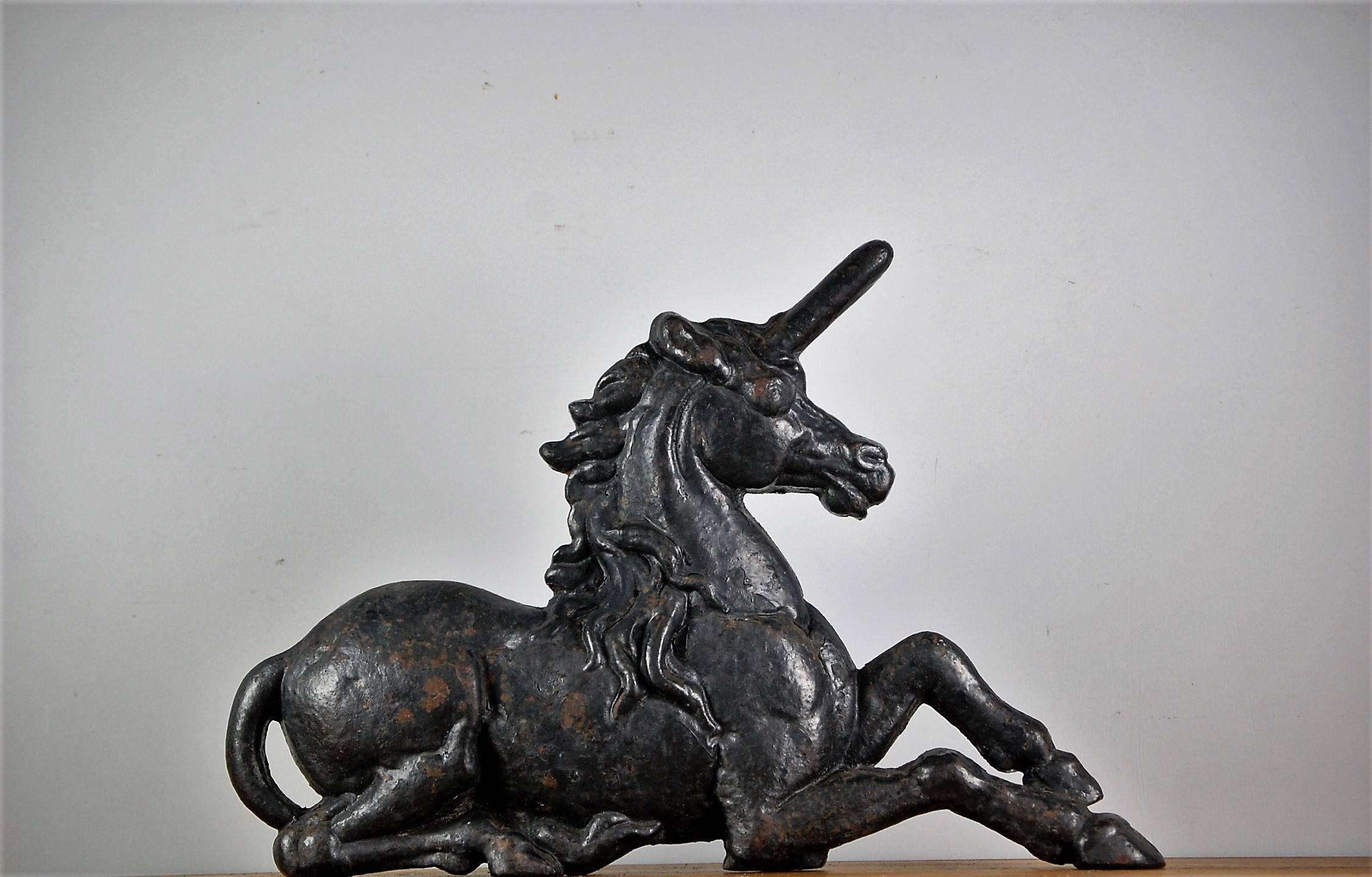 19th century cast iron fireside unicorn, design attributed to John Crowley of Sheffield, UK. Representing the Scottish unicorn in the royal coat of arms. High quality casting, commonly used as a door stop. Distressed painted finish.