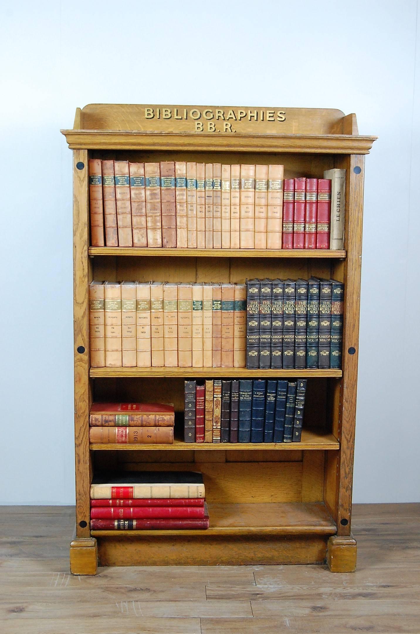 Late 19th century, beautifully made, double sided oak library bookcase, sign written. Adaptable original shelving system. Originally made for Ealing Library (London UK), Residing its later life at Stanage Park, a listed country house based in