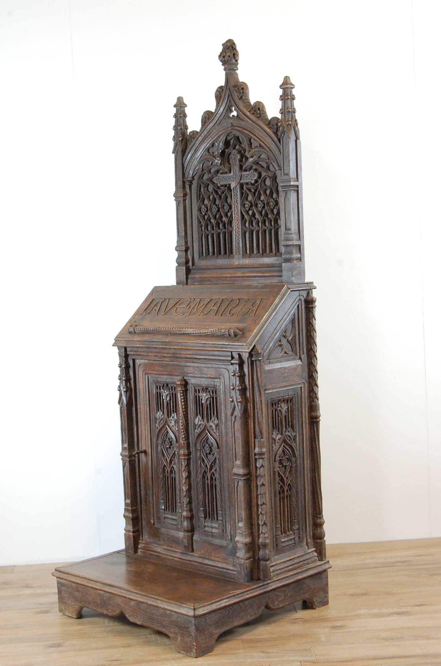 Mid-19th century heavily carved oak Prie - Dieu, highly ornate carving, designed for private devotional use. This is a fine example, with original key for lower cupboard, the top section does remove, there are one or two minor losses on the carving,