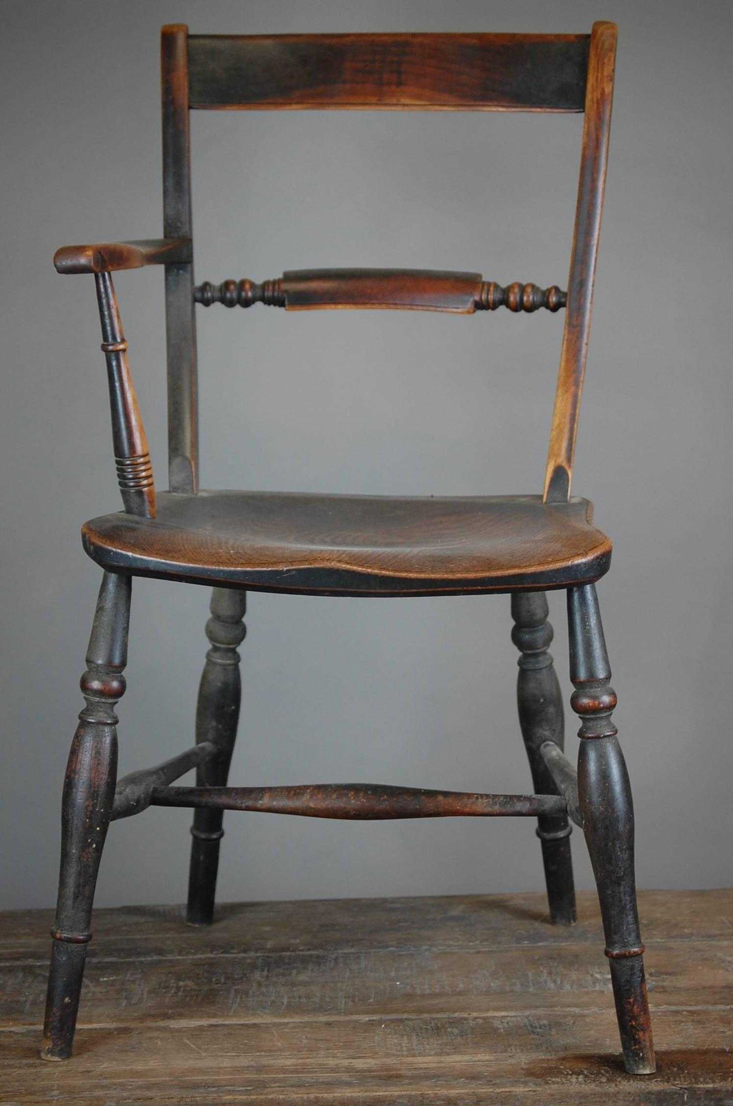 Wonderfully unusual late 19th century one armed military officers windsor chair. Manufactured with one arm to accommodate the officers dress sword whilst sitting. Totally original, wonderful patina.