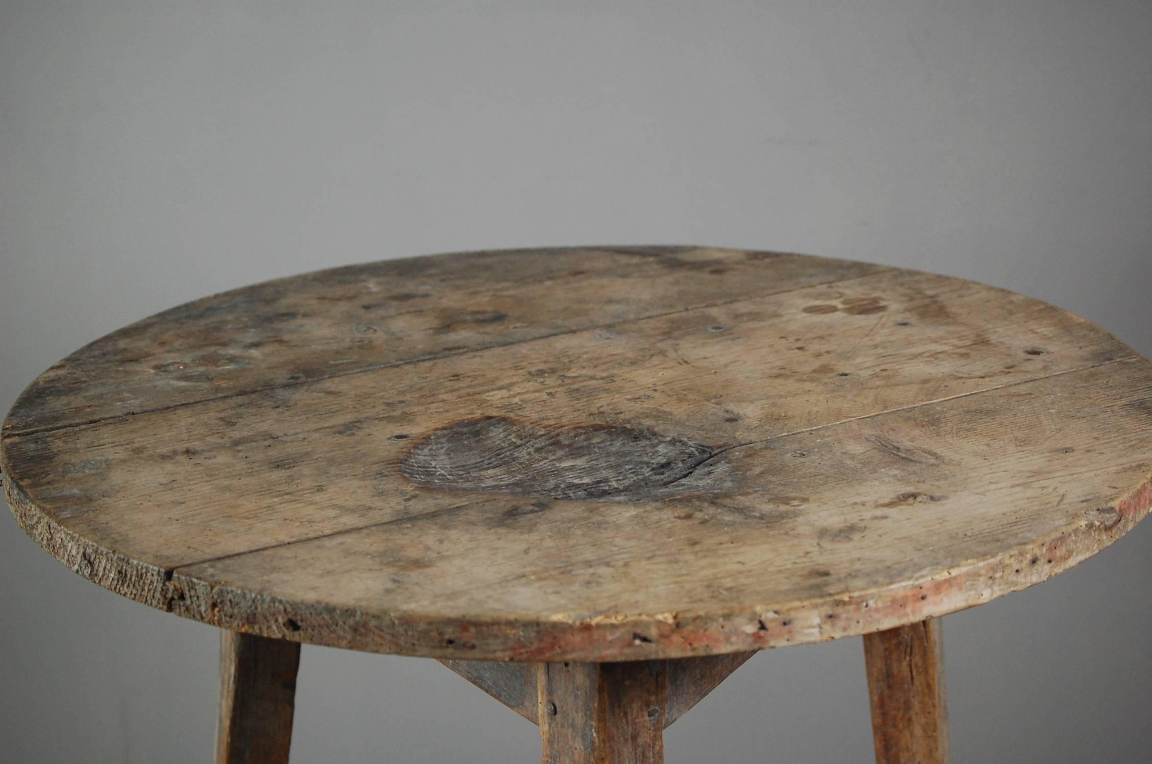 Late 19th century pine tavern cricket table, untouched dry finish, with burn mark to the surface no doubt from an oil lamp spill. Honest original piece.