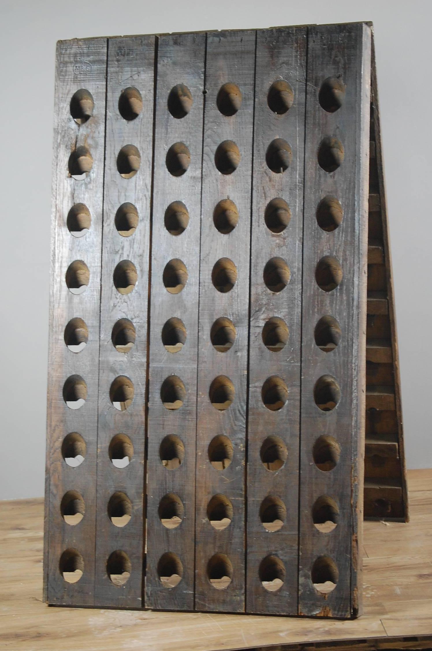 20th century Moet and Chandon oak champagne riddle rack. Used in the final stages of fermentation of Champagne, the bottles are turned daily whilst stored in these racks. This particular example is from the Moet & Chandon producer and is marked as