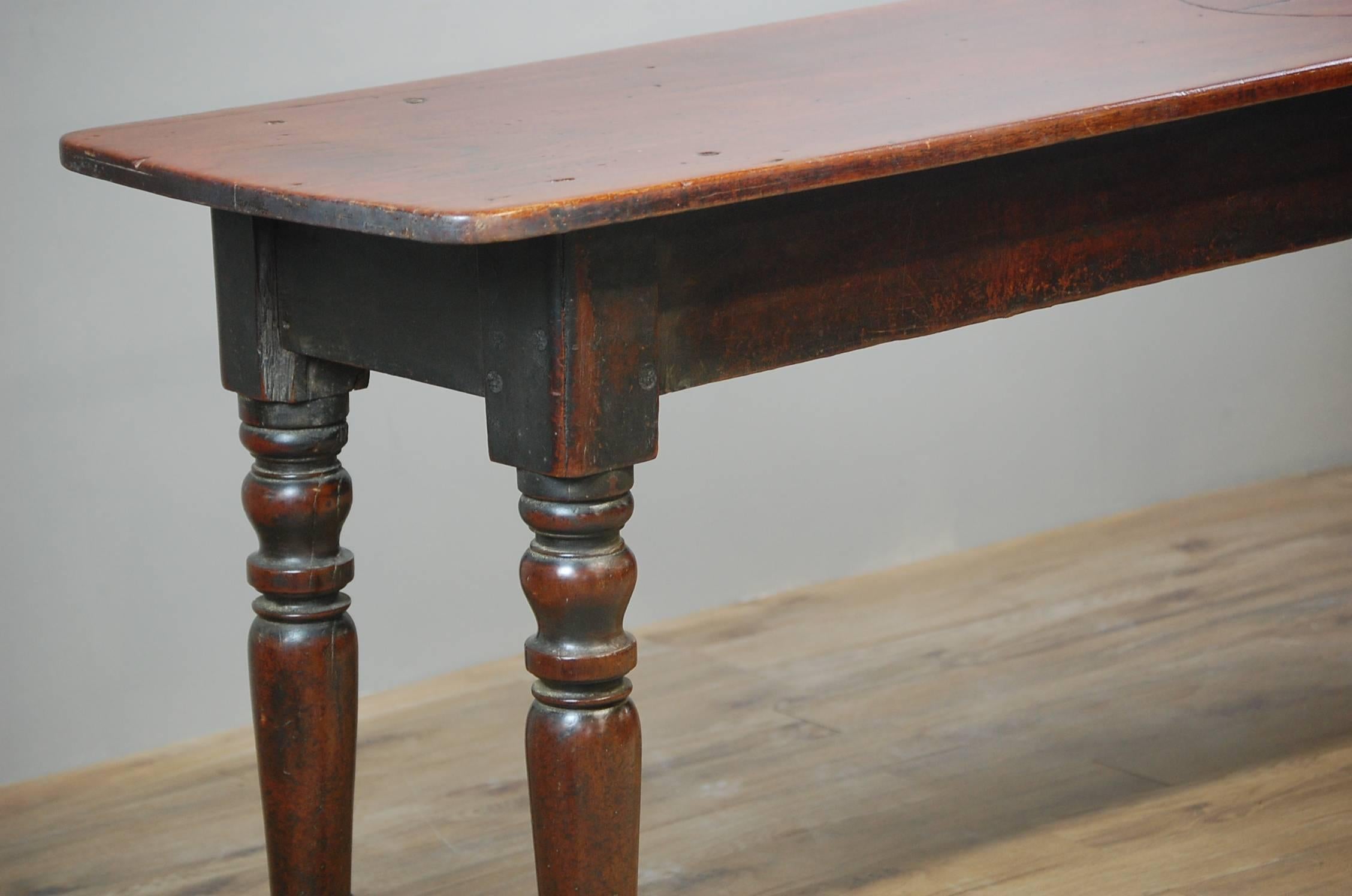 19th century English serving table, with naïve scratch carved tavern games table surface. Wonderful patina, untouched and baring scars of tavern life. Believed to be a type of unusual shove ha'penny style game. One old split to the table surface
