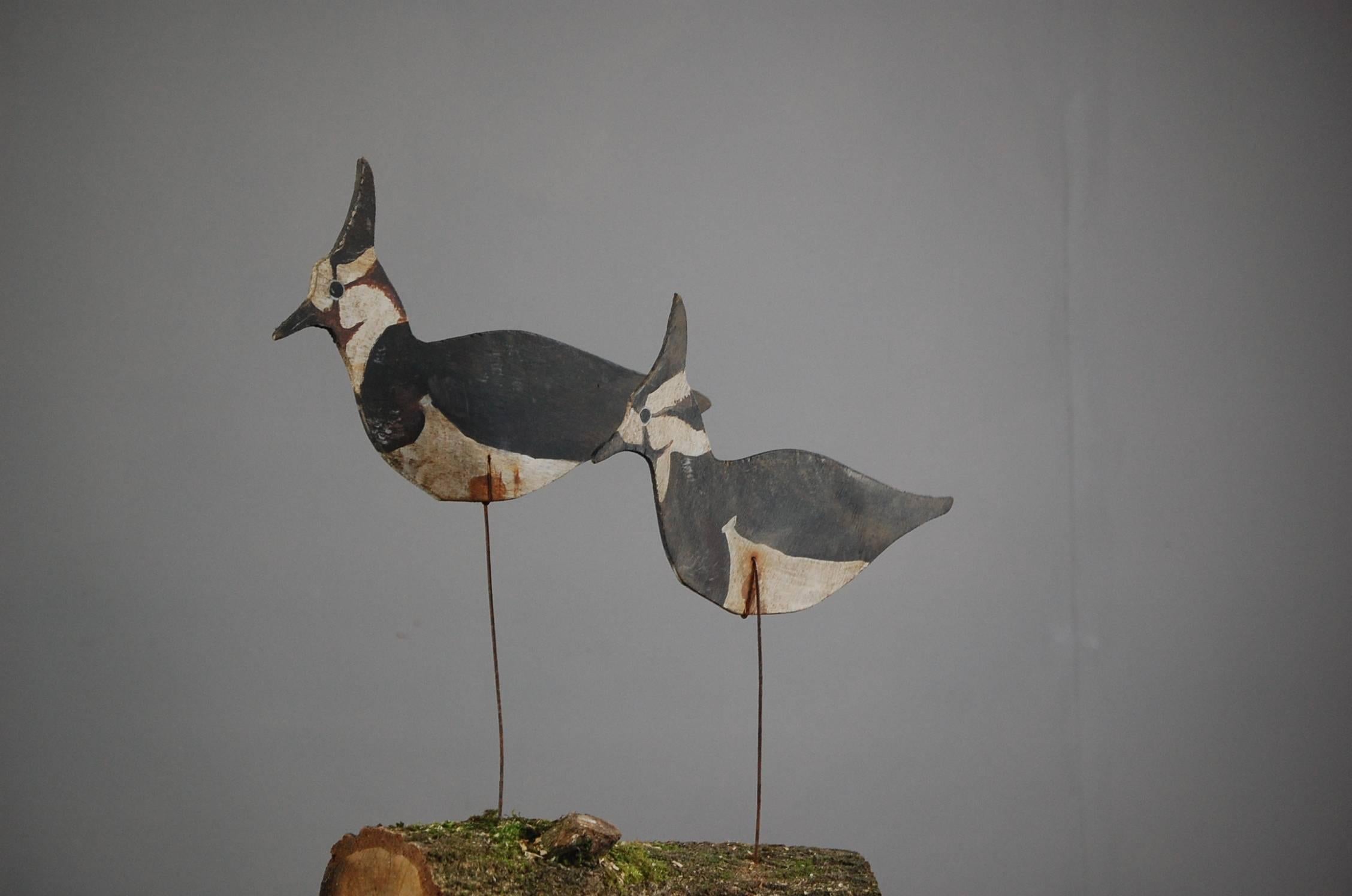 Pair of Silhouette lapwing decoys, original paint, and original mounts, mounted on a later log base mount. Made and painted by Jacques Delaittre (1938-2016), for his own use, France, circa 1970.
   