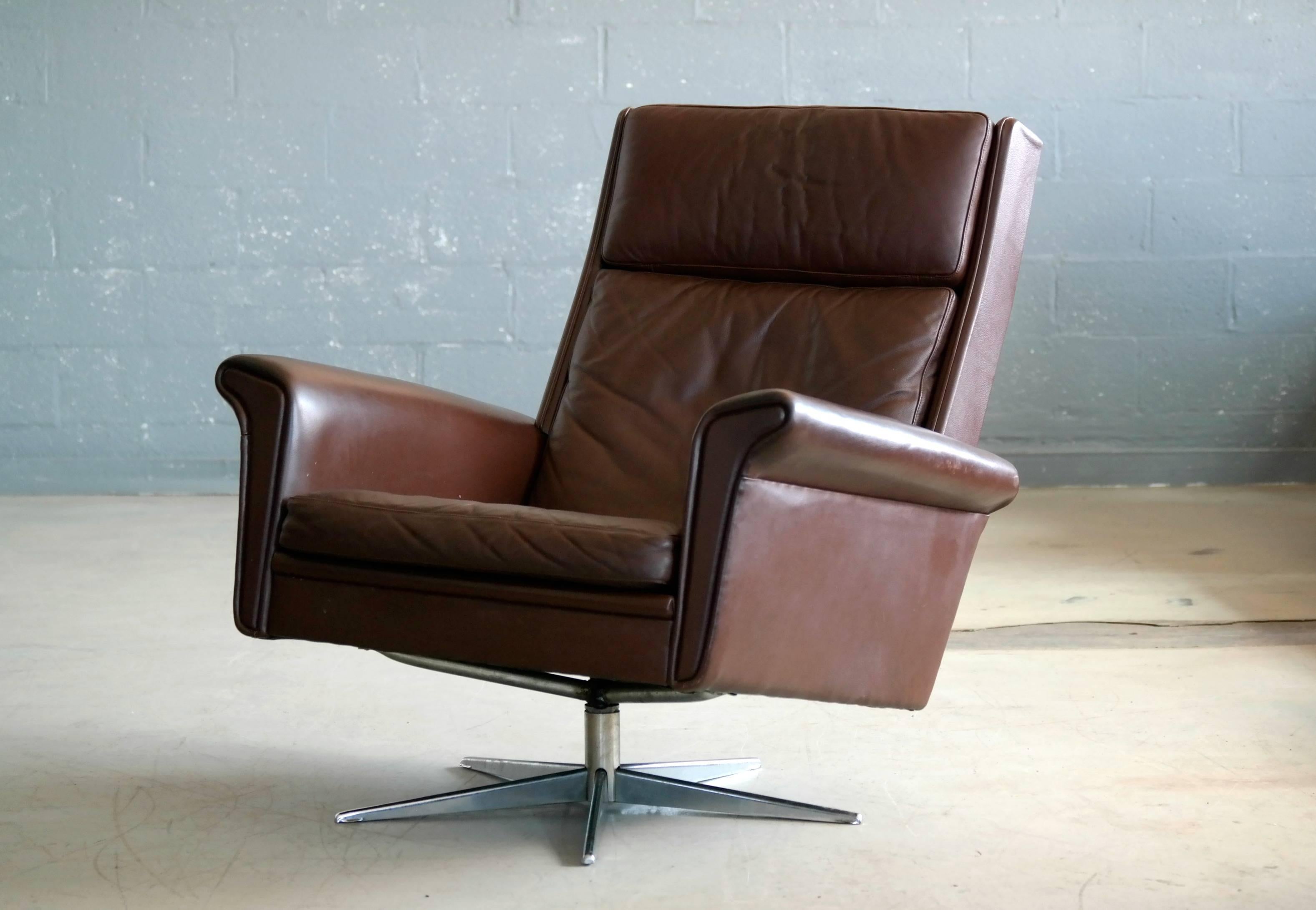 Stainless Steel Pair of Danish High Low Swivel Lounge Chairs in Chocolate Leather by Georg Thams