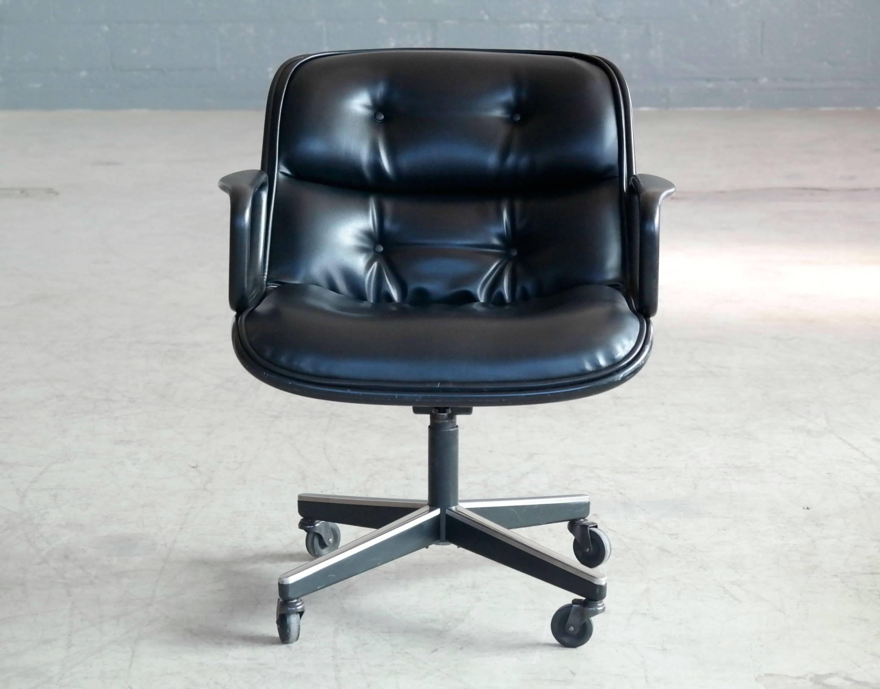Charles Pollock’s timeless leather upholstered swivel executive chair designed in 1965. These chairs produced around 1975 still have the original Knoll labels attached. The Executive chair was designed using Pollock's ‘rim technology’, where all the