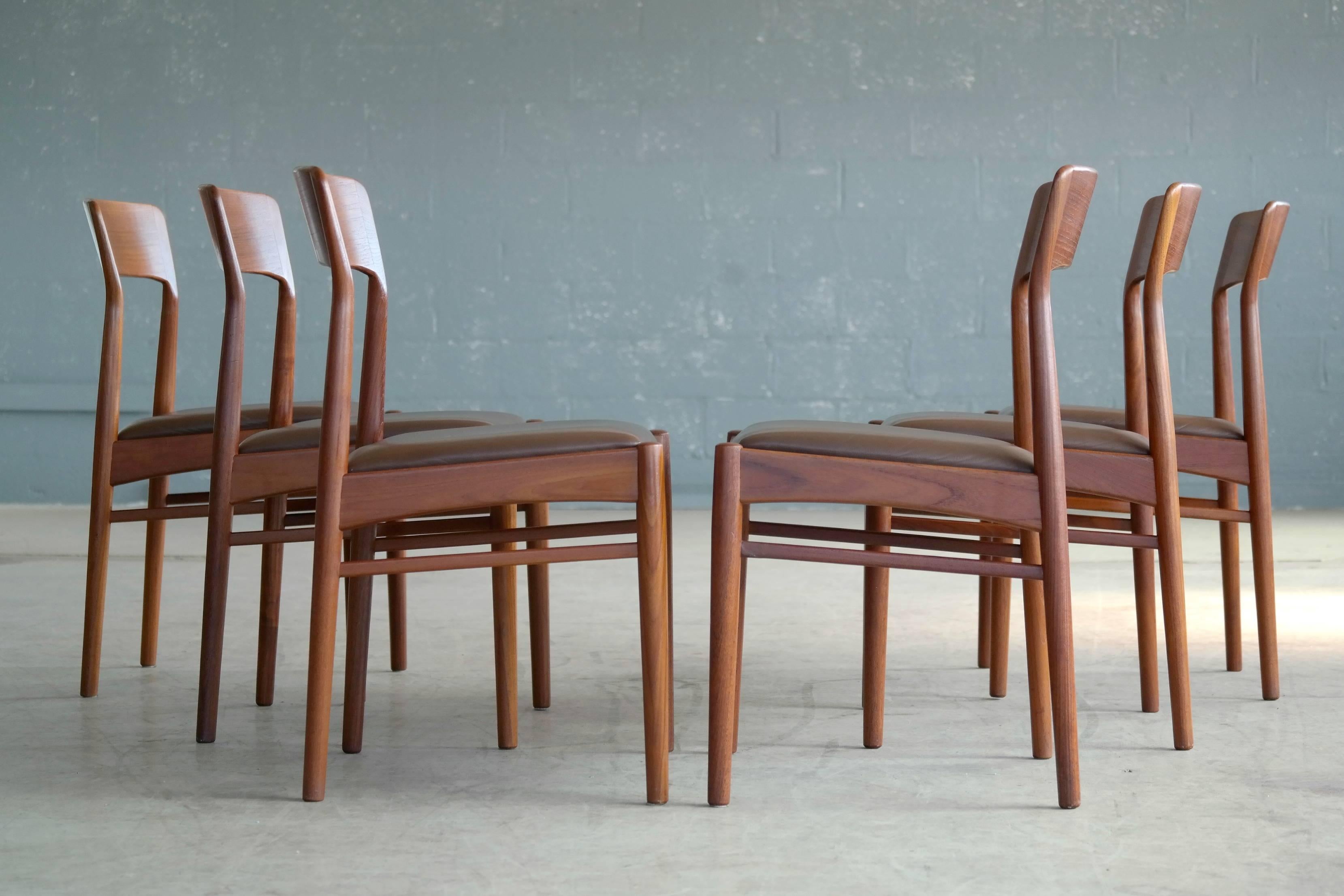 Fantastic set of ten dining chairs teak with leather seats designed in the 1960s by Kai Kristiansen for K.S. Mobler of Denmark. The style of the Kai Kristiansen chairs is easily mistaken for N. O Moller and they are of a very comfortable and classic