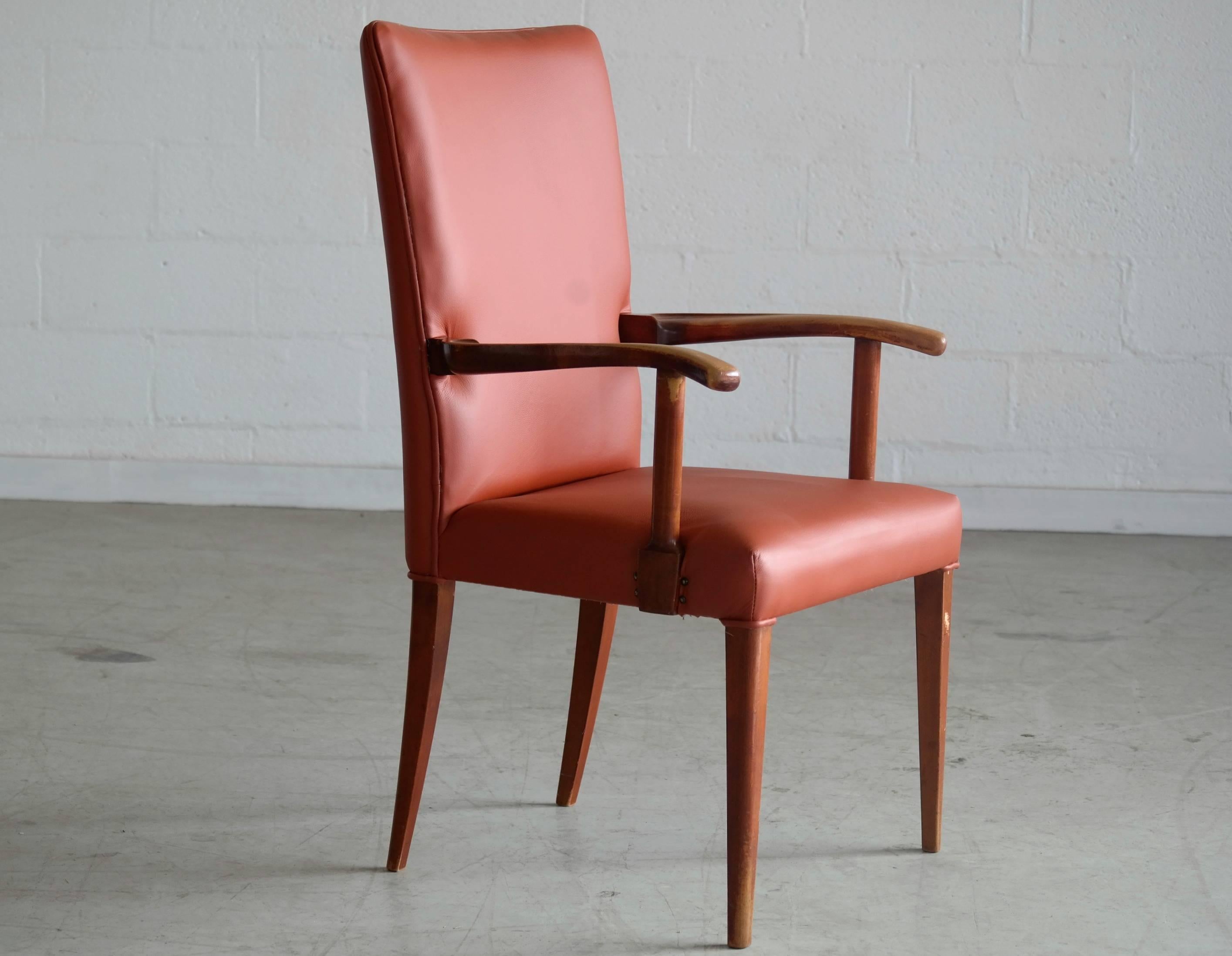 Historical Danish armchair by Frits Henningsen in mahogany and leather originally owned by Erik Ninn-Hansen. The chair stood in his office in the government building, Christiansborg throughout his long career. The chair shows age appropriate patina