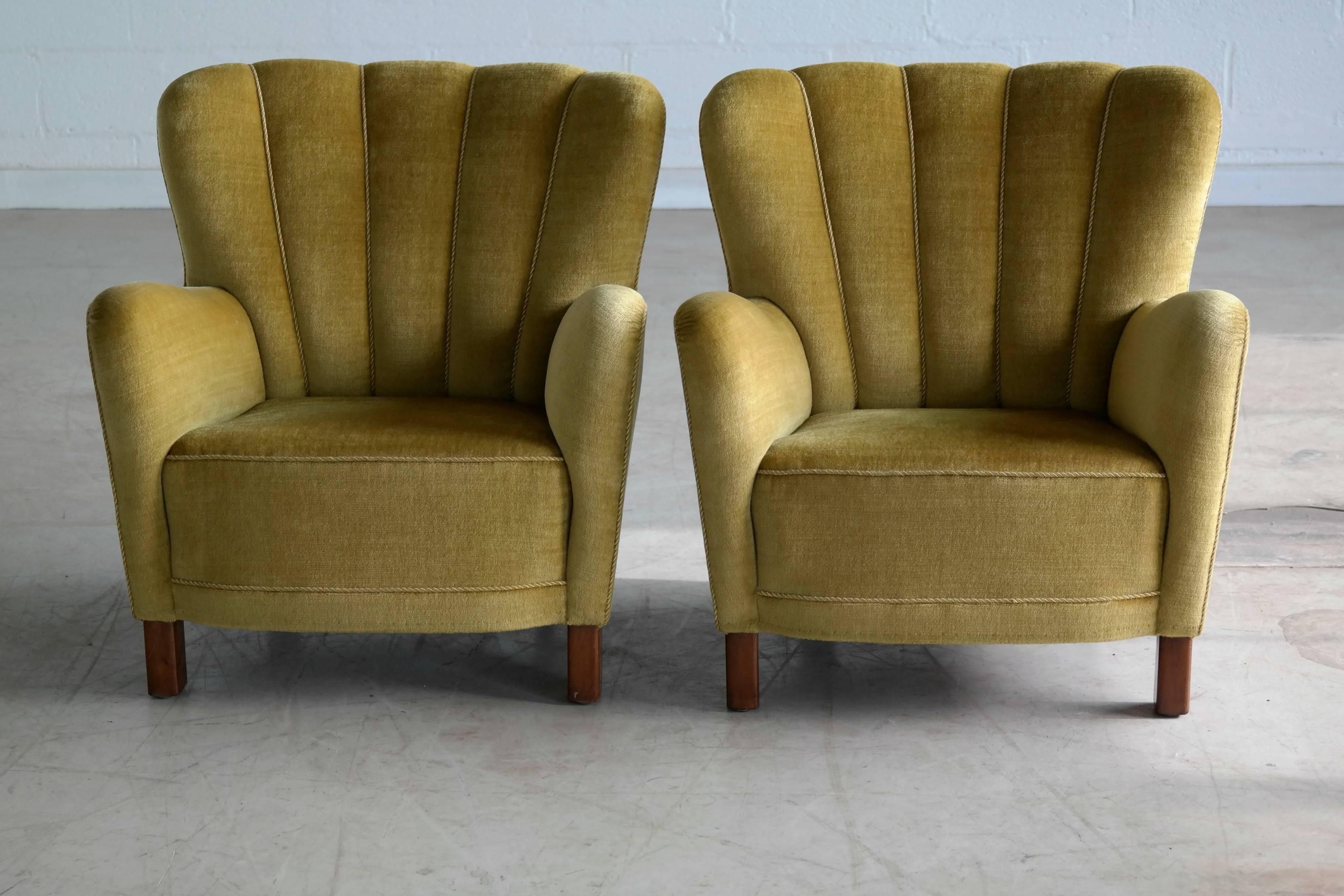 This rare set of Danish armchairs retain the iconic style of the large armchairs of the era but are smaller in scale and thus very suitable for today's urban Dwellings. Very coveted 'variant" as Fritz Hansen calls it and rarely found. Seat and