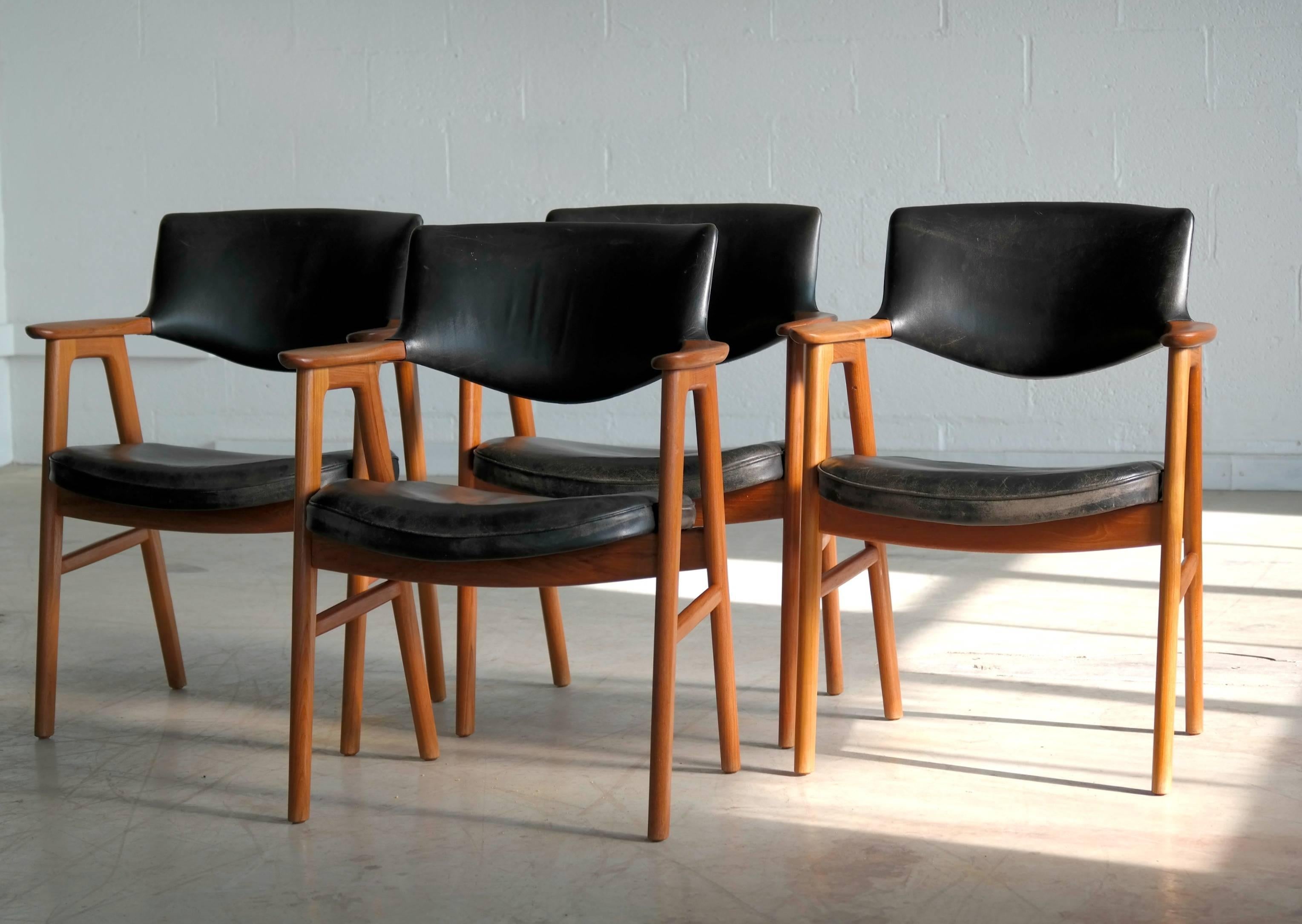 Fantastic set of four dining chairs Rare set of ten armchairs designed by Erik Kirkegaard. Produced by Høng Stolefabrik in Denmark. made of solid teak and cushions and backrest in black leather. Leather shows wear and patina appropriate for its age