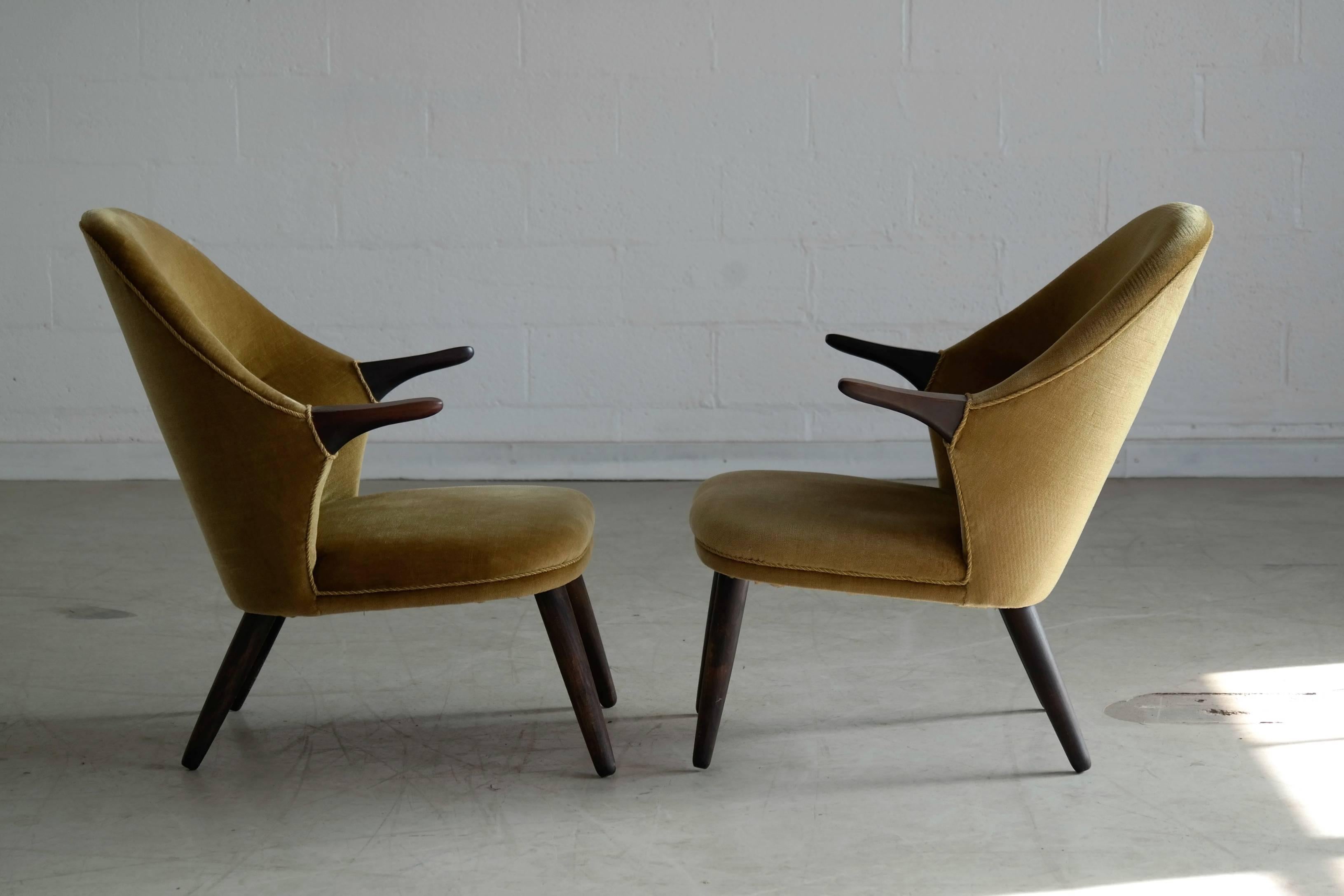 Very rare pair of 1950s easy chair in Hans Wegner's 'Mama Bear" style made by Danish manufacturer Colviggard. Covered in a golden mohair velvet in very good original condition. These chairs are beautifully and aesthetically pleasing and  add