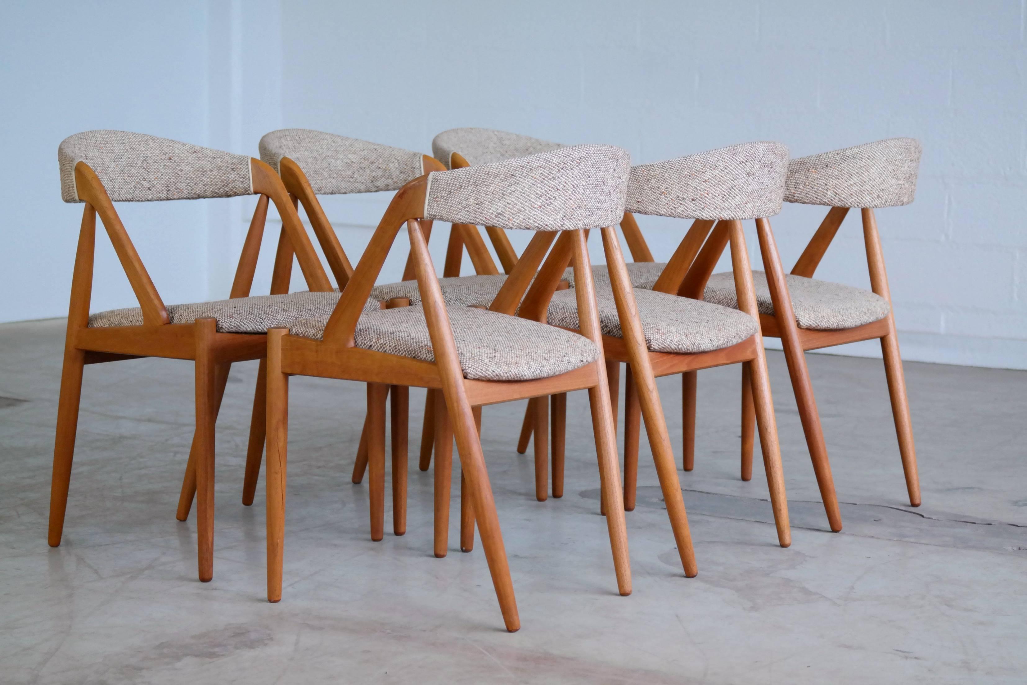 One of the most sought after Classic dining chairs designed by Kai Kristiansen in 1956 for Schou Andersen Møbelfabrik in Denmark. Made with a solid teak frame the chairs still have their original seat covers which remain firm and in good