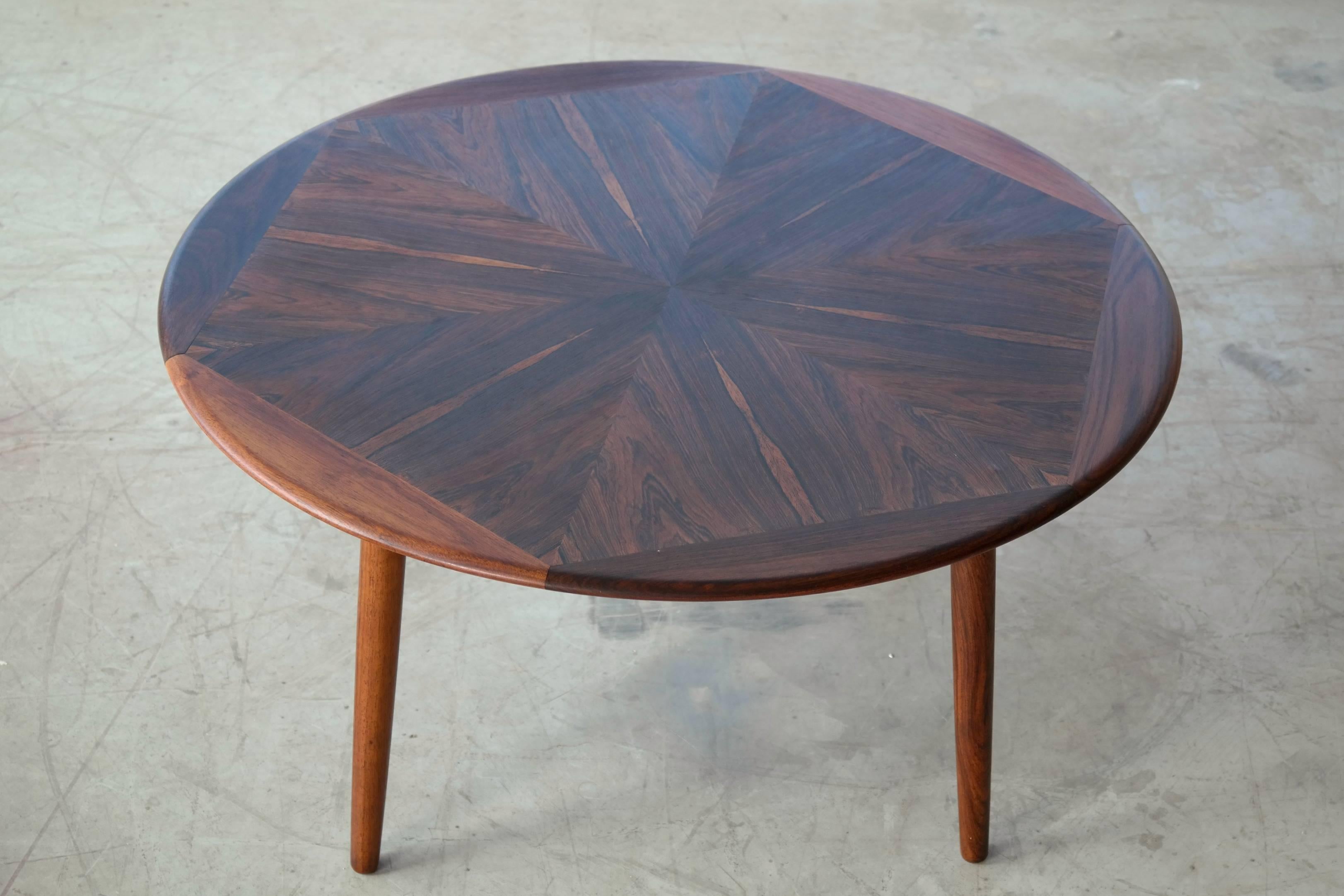 Beautiful round coffee table in book matched rosewood veneer by H.W. Klein for Bramin Mobler, Denmark.