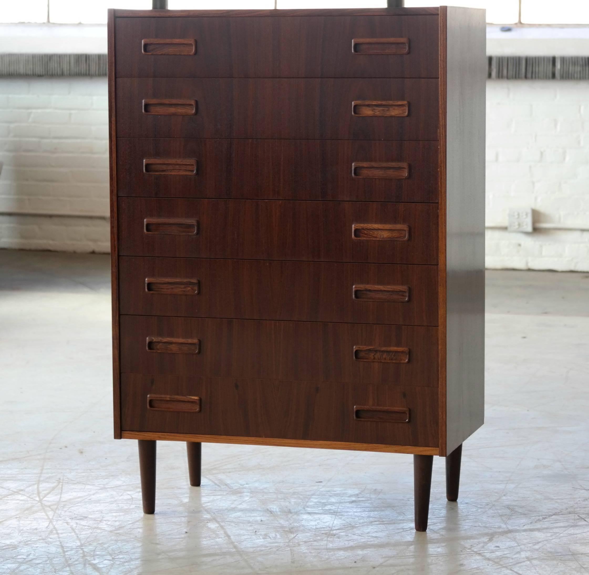 Superb tall dresser in rosewood in very good condition by P. Westergaard Mobler of Denmark, circa 1960 with minimal age wear. Nice carved pulls and solid edges. Dovetailed drawers in solid ply.
