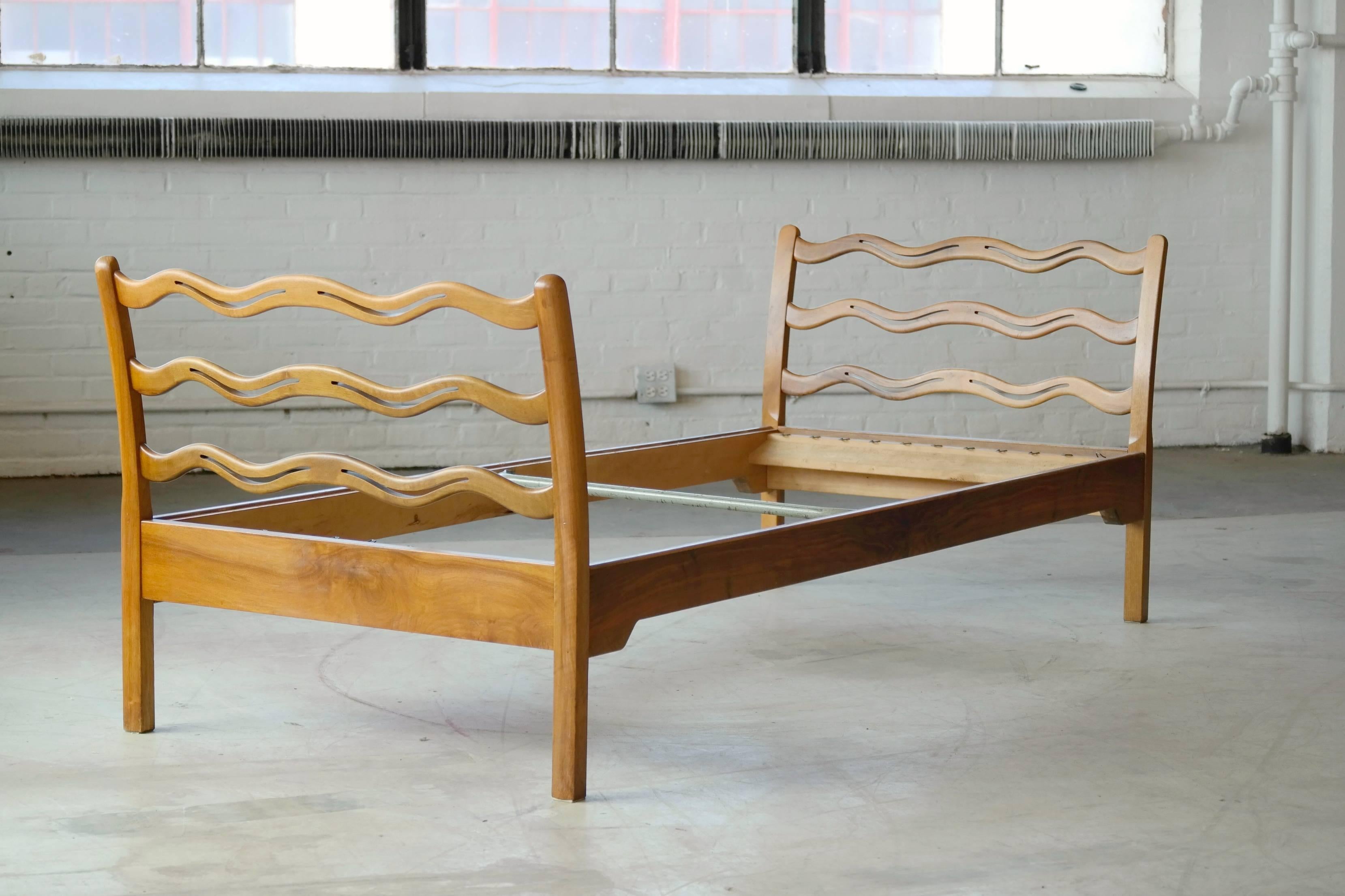 Fantastic Danish early Mid-century guest bed designed by Ole Wanscher for Fritz Hansen, circa 1945 in stained beech. This elegantly designed bed is rarely seen in the market and the last sale we have noted in the US was in 2010. Stamped 'FH"