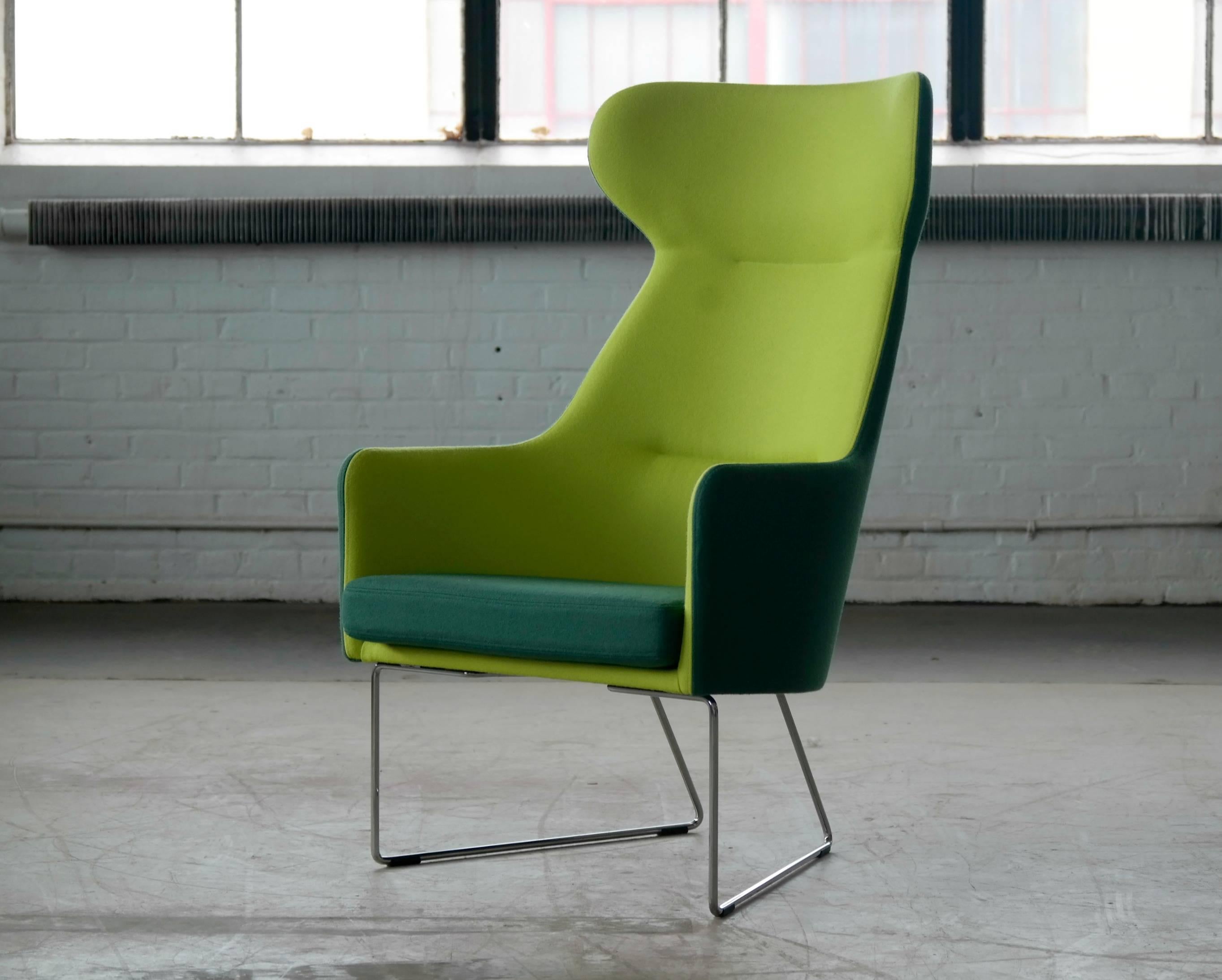 Award winning modern take on a high back wing chair in steel and wool by Bernt Petersen for GETAMA. Exuberant wool felt fabric by Kvadrat.