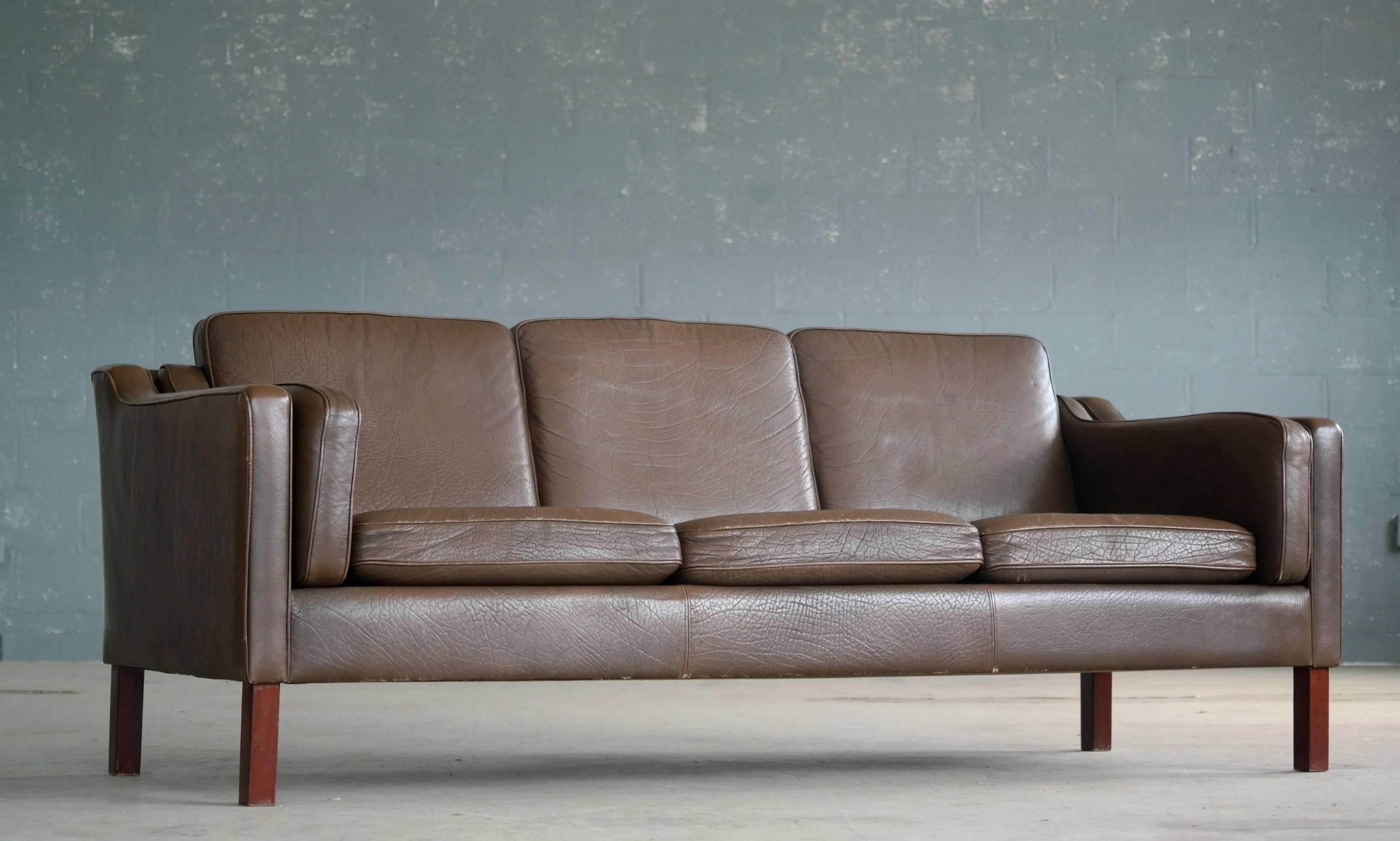 Børge Mogensen style sofa in chocolate brown leather by Mogens Hansen, designed in the late 1960s and likely produced sometime in the 1970s. Very good condition with natural age appropriate wear and patina.
 