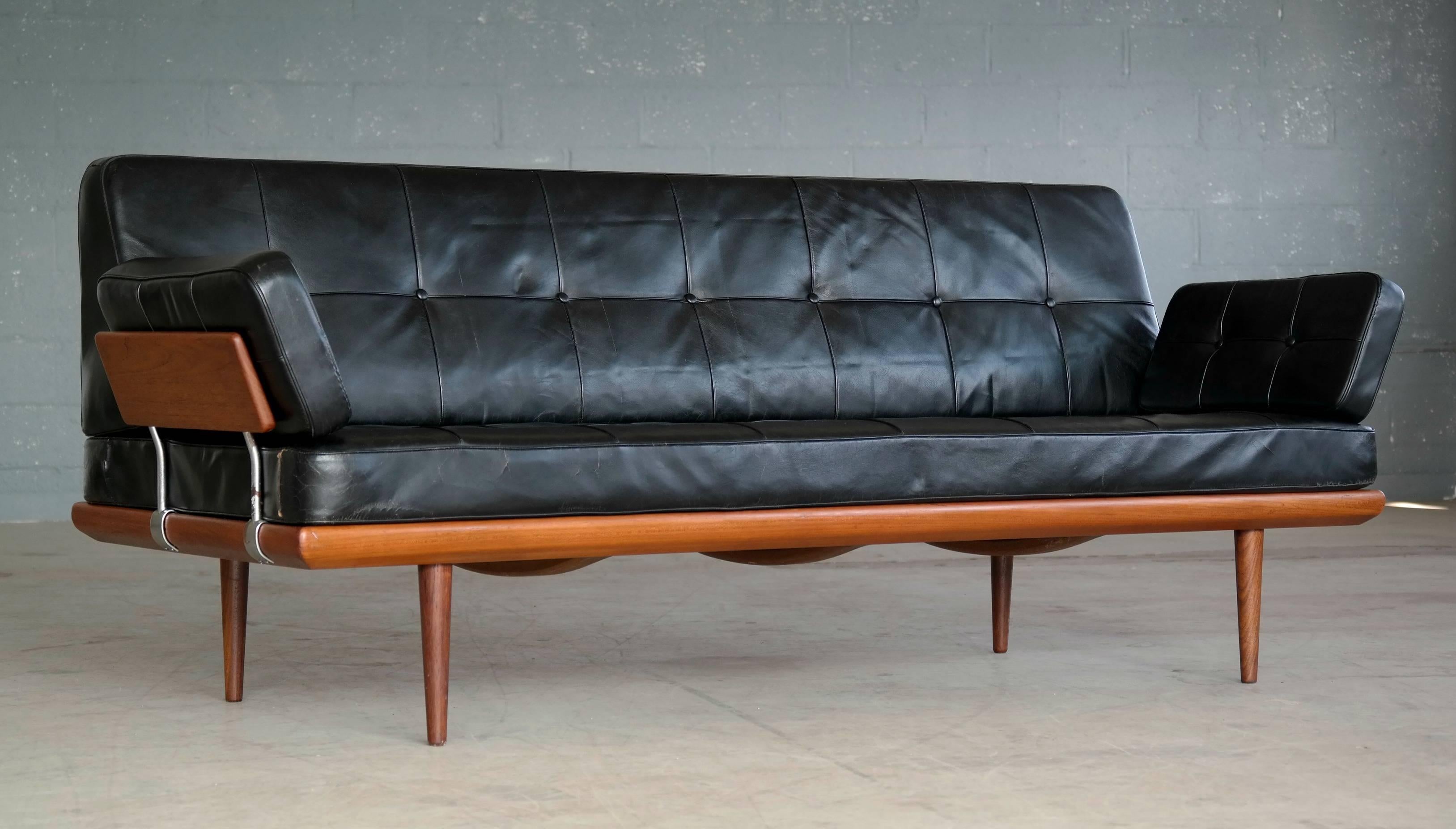 A model Minerva sofa/daybed one of the most Classic and sought after Danish sofas from the famous design duo of Peter Hvidt and Orla Mølgaard-Nielsen for France and Son. 

The backrest and spring mattress covered in it's original black leather