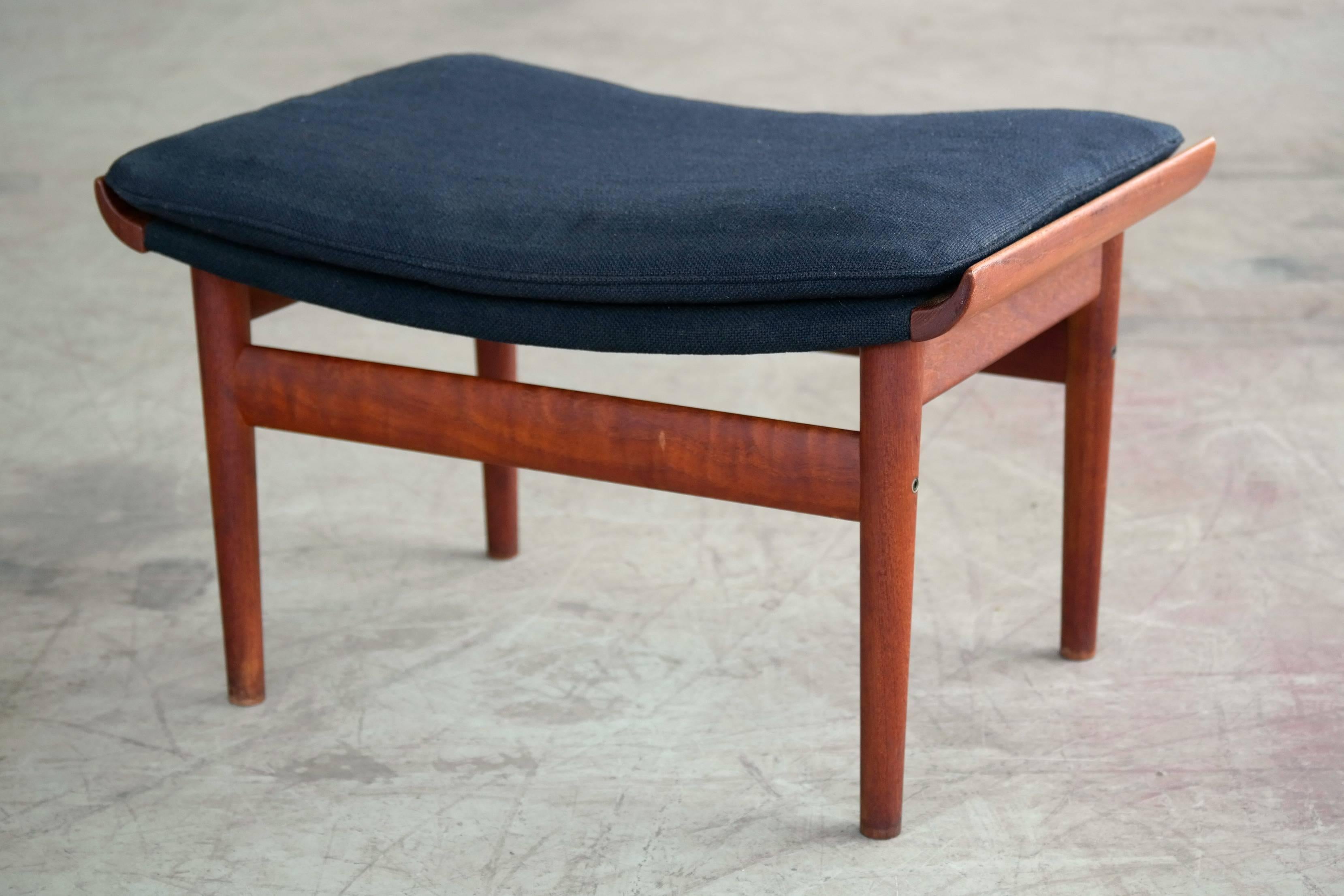 This Bwana chair and ottoman were designed by Finn Juhl for France & Son in Denmark in 1961. The piece features a solid teak frame and original black fabric by Kvadrat. Perfect companion for the Bwana chair.

Overall excellent condition.

 