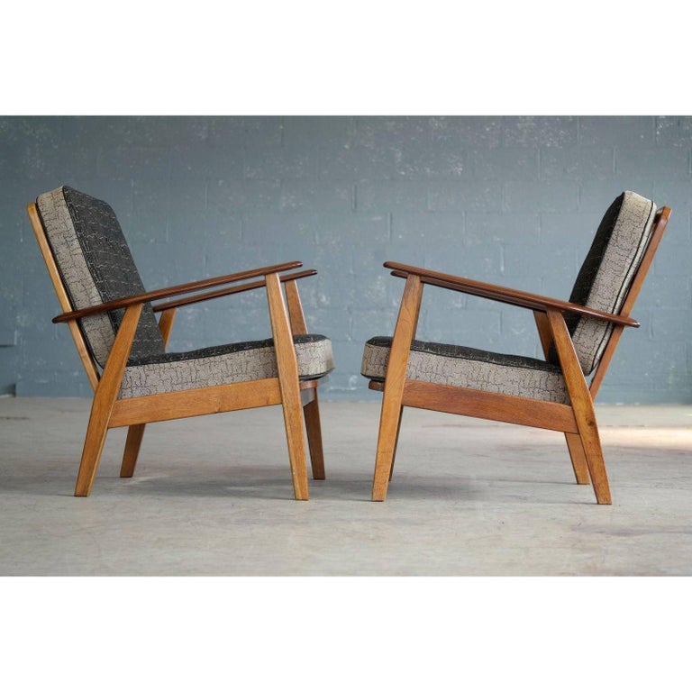 pair of danish hans wegner style midcentury easy chairs in teak for