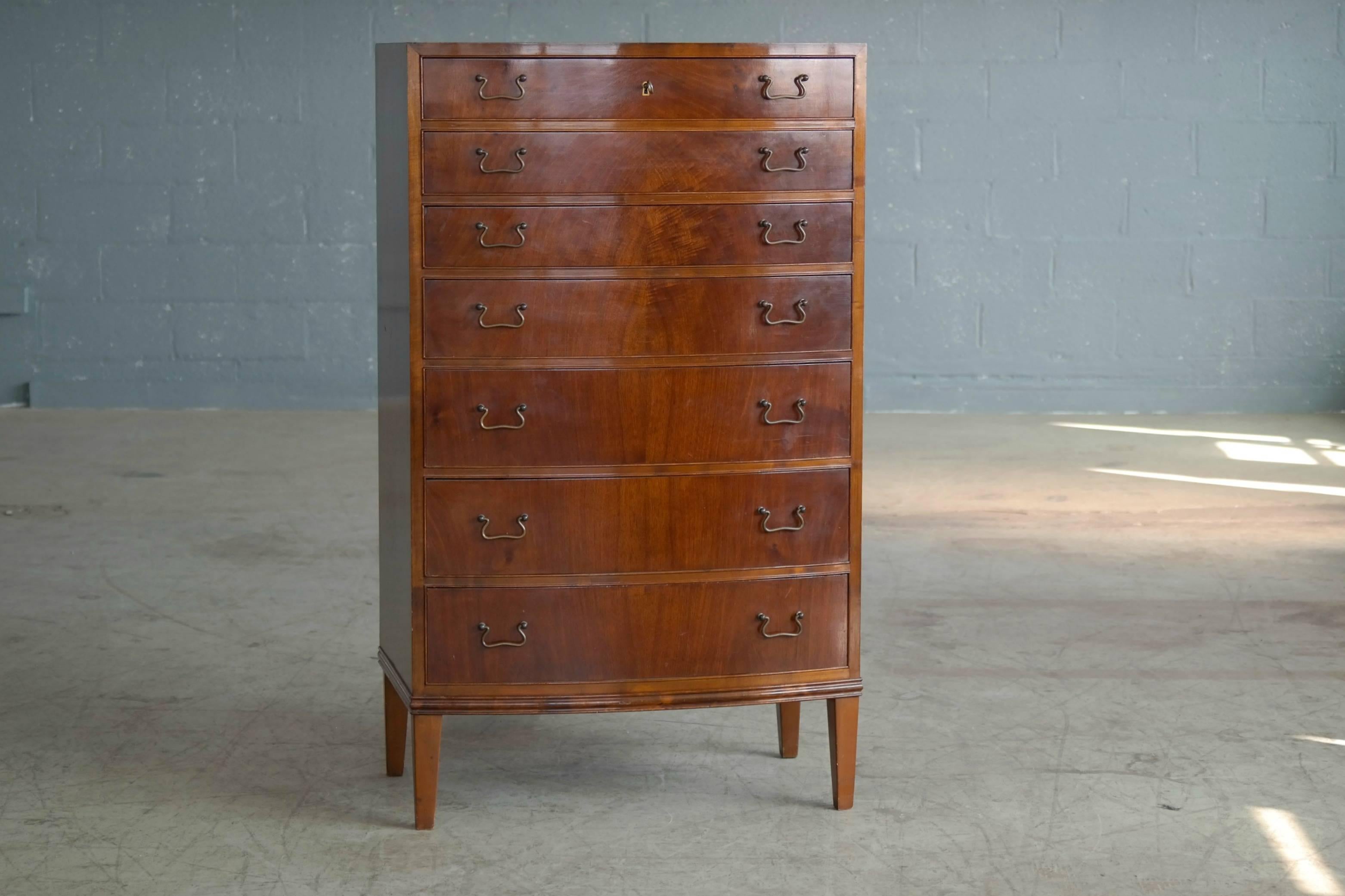 Incredibly elegant 1950s dresser or chest of drawers made by Master Carpenter, Georg Kofoed of Copenhagen, circa 1950. All solid and veneered Cuban mahogany with solid ply dovetailing and antiqued brass pulls. Highest quality craftsmanship. Superb.