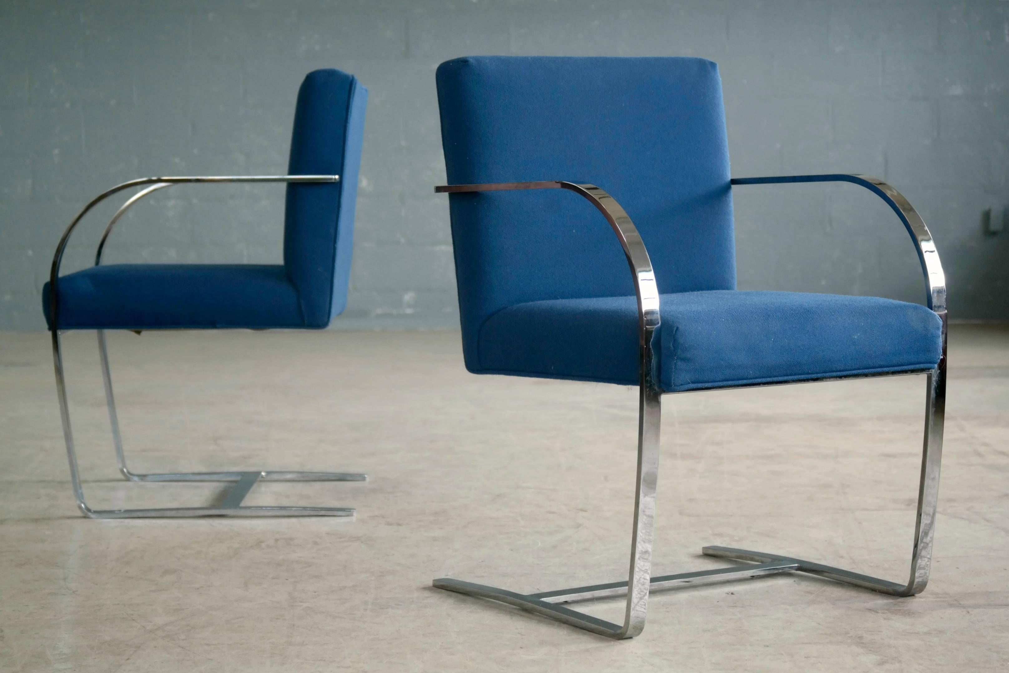 Pair of arm or side chairs in the Classic style of the Brno chairs my Knoll. These beautiful chairs in chrome and blue wool fabric have a label from the Designer's Furniture Center Intl. in Manhattan but no Knoll label. Very good condition with no
