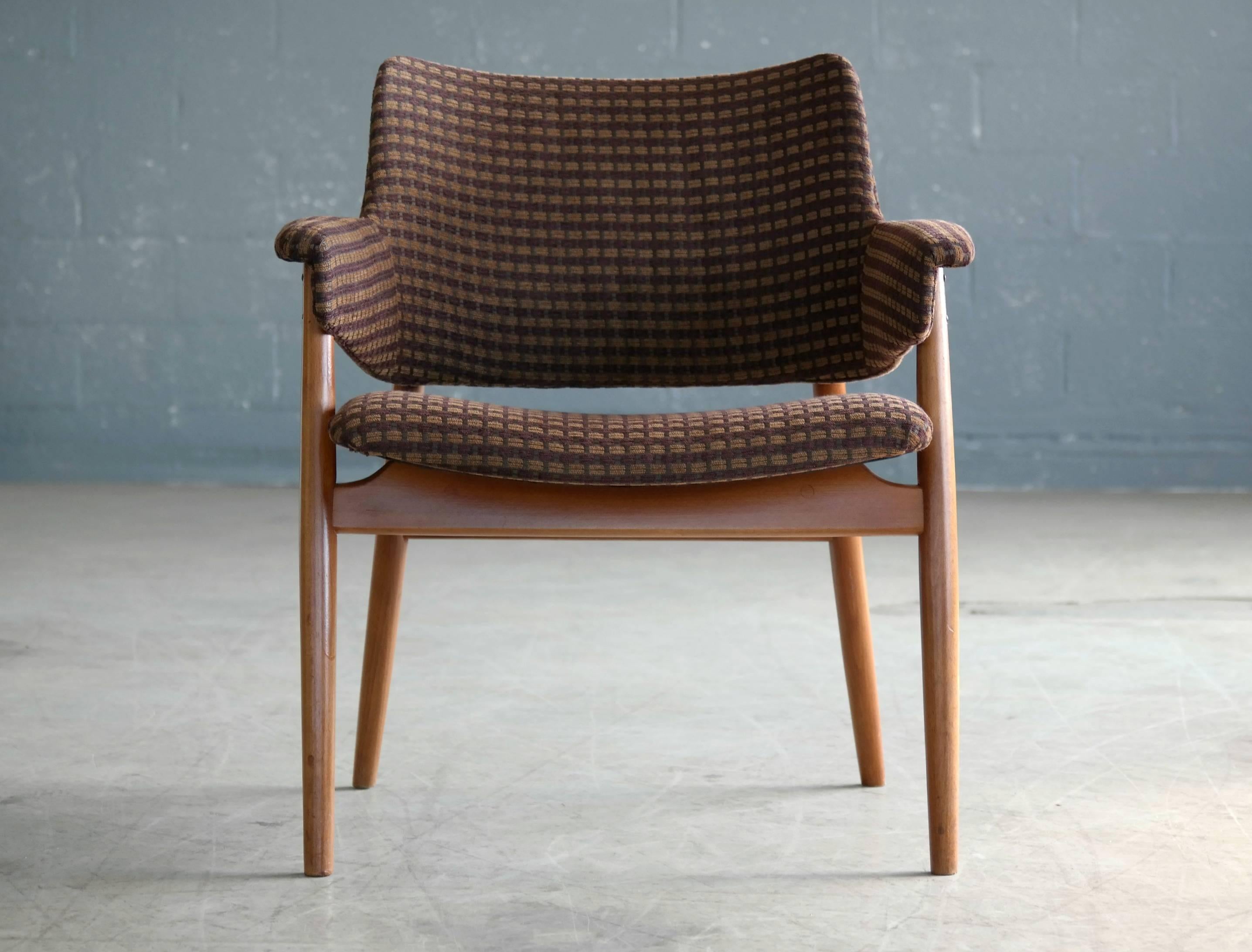 Classic 1950s small lounge or side chair in beech and fabric. The chair is very much in the style of Hans Olsen and some of his famous designs for Bramin Mobler. Highly decorative - sturdy and sound. Overall very good condition.