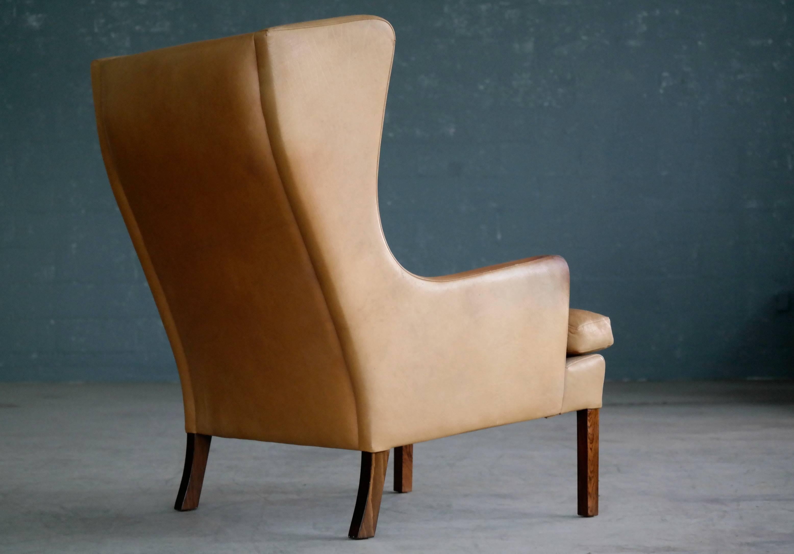 Mid-20th Century Borge Mogensen Style Wingback Lounge Chair and Ottoman in Butterscotch Leather