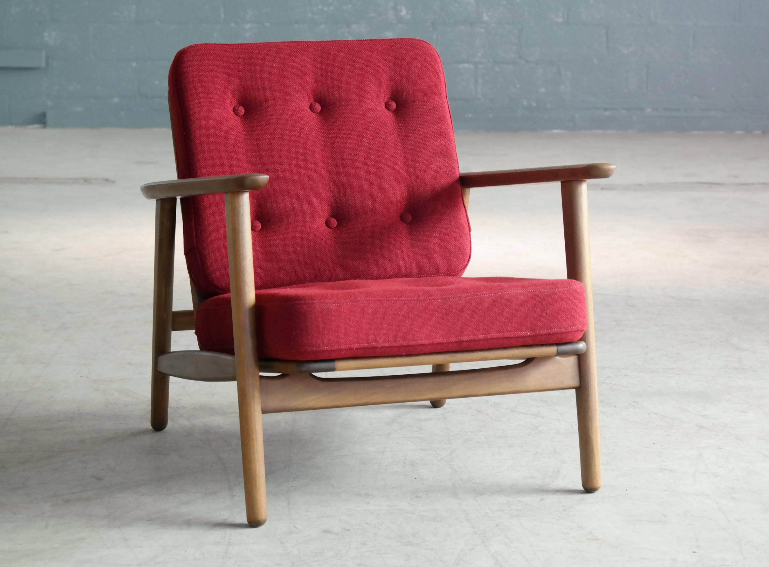Classic and rare easy chair in beechwood designed by Hans Wegner for GETAMA, Denmark as Model GE-233. The GE-233 was one of the first designs Wegner made for GETAMA, circa 1952 and was made just before teak started to become the material of choice