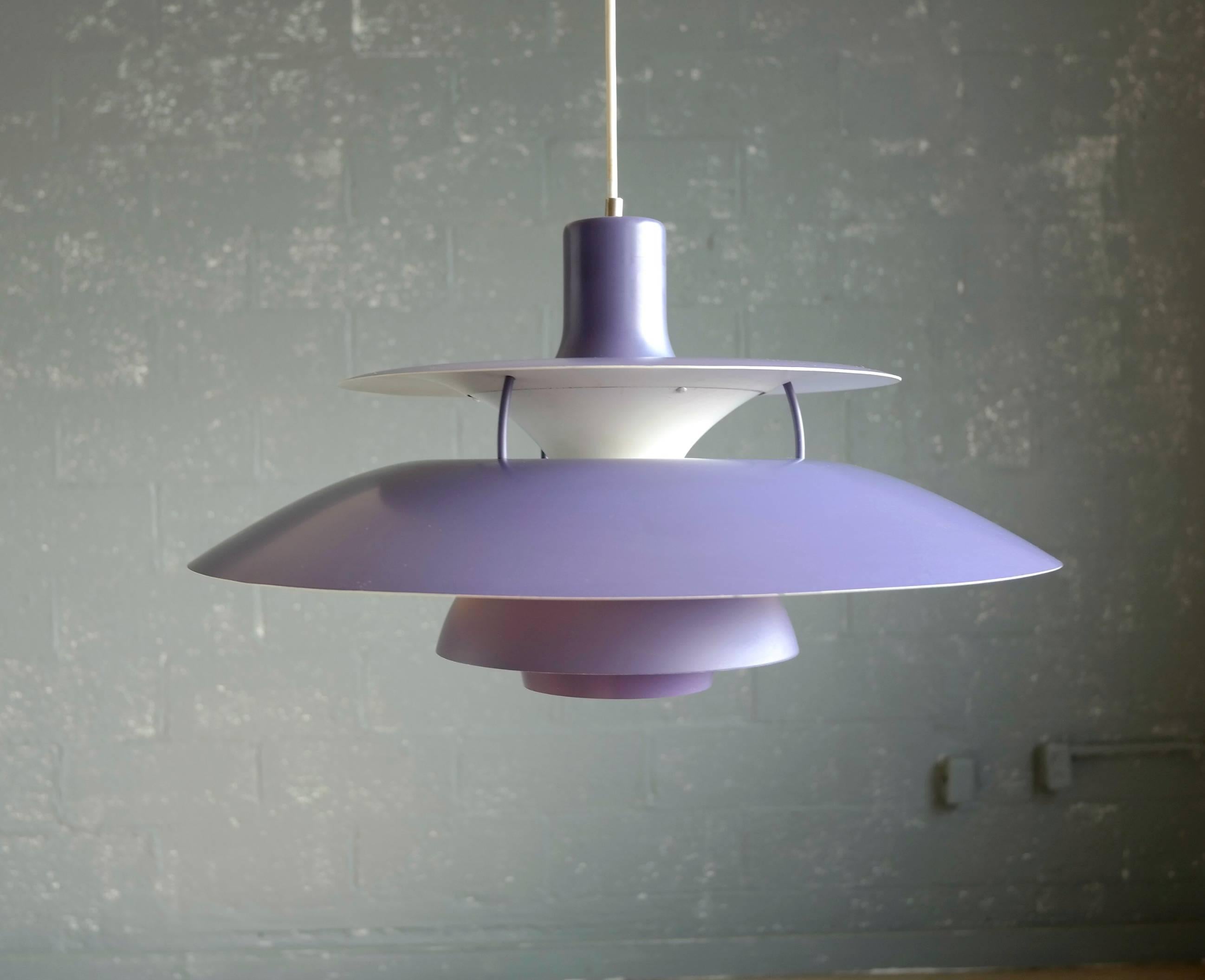 This iconic PH-5 pendant lights in aluminium by Poul Henningsen for Louis Poulsen originally launched in 1966. This is in a very vibrant limited edition purple incarnation made, circa 1980 with interior cone and reflector in silver working in tandem