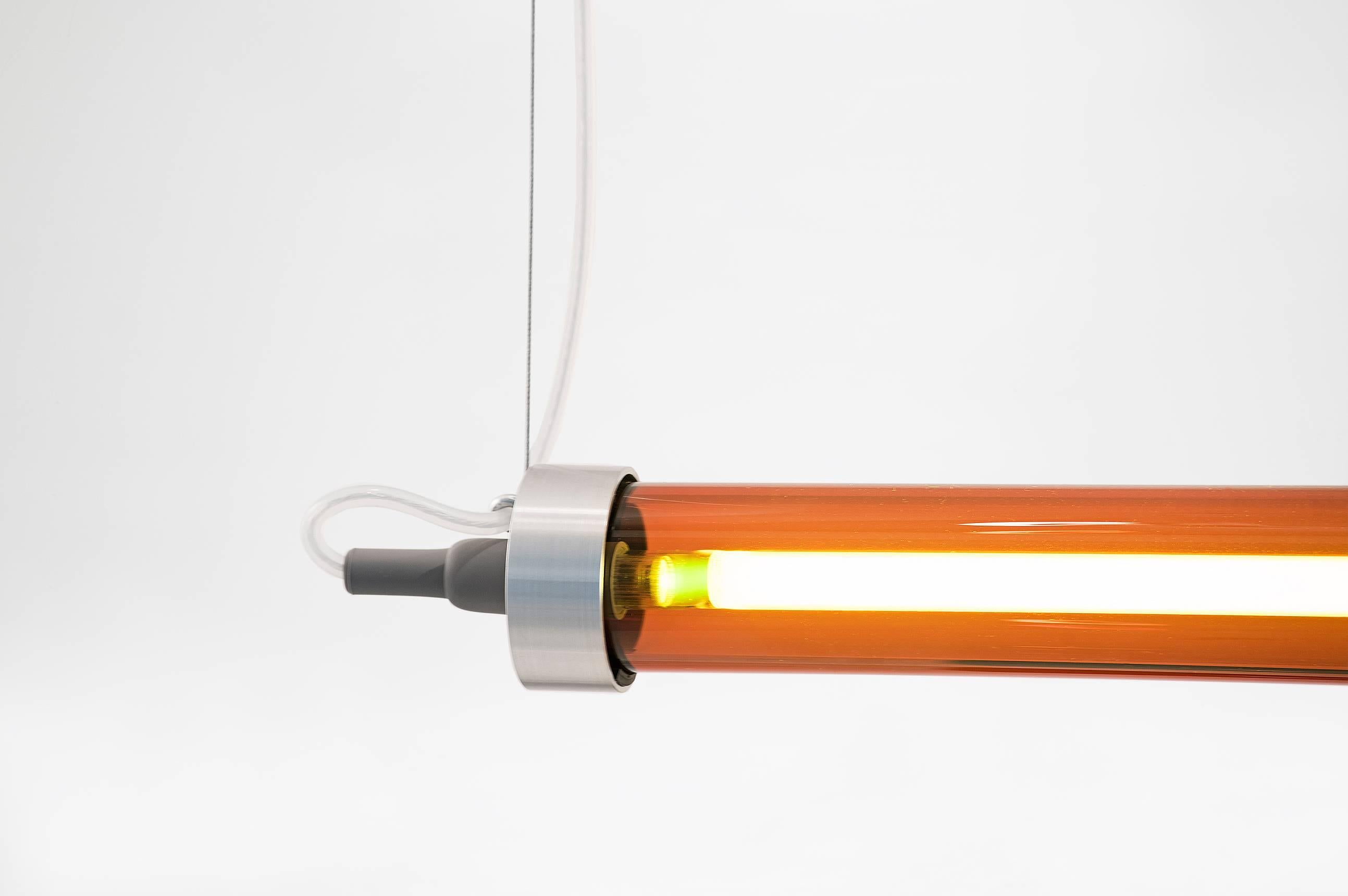 Sabine Marcelis

Ceiling lamp model “Horizontal Amber”
From the series “RAY”
Manufactured by Sabine Marcelis
Produced in exclusive for side gallery
Rotterdam, The Netherlands 2017
Colored glass tube in amber, white neon

Measurements
120