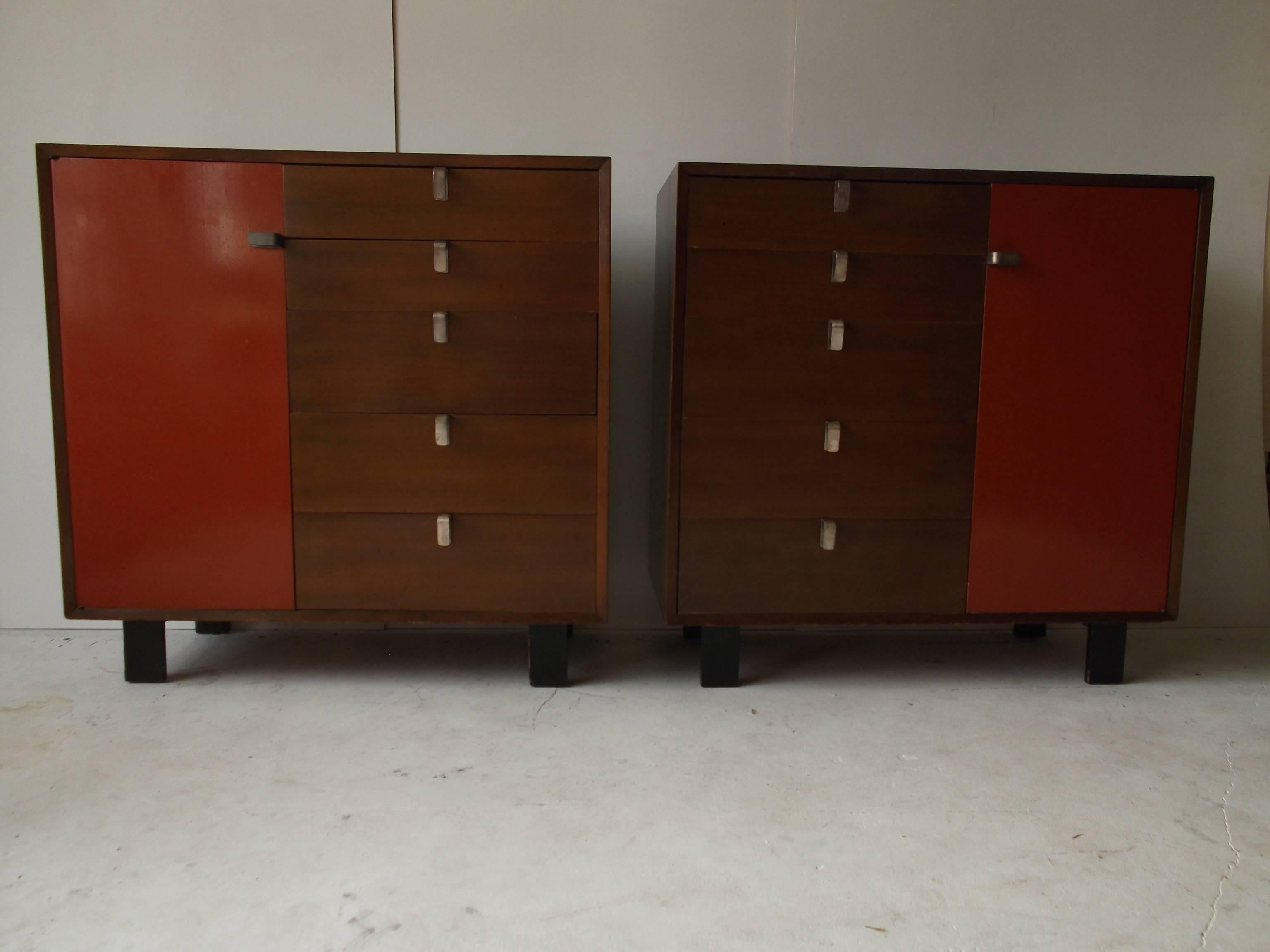 Gorgeous matched pair of original George Nelson dressers for Herman Miller in walnut, with original factory Salmon orange cabinet doors. My favorite, 