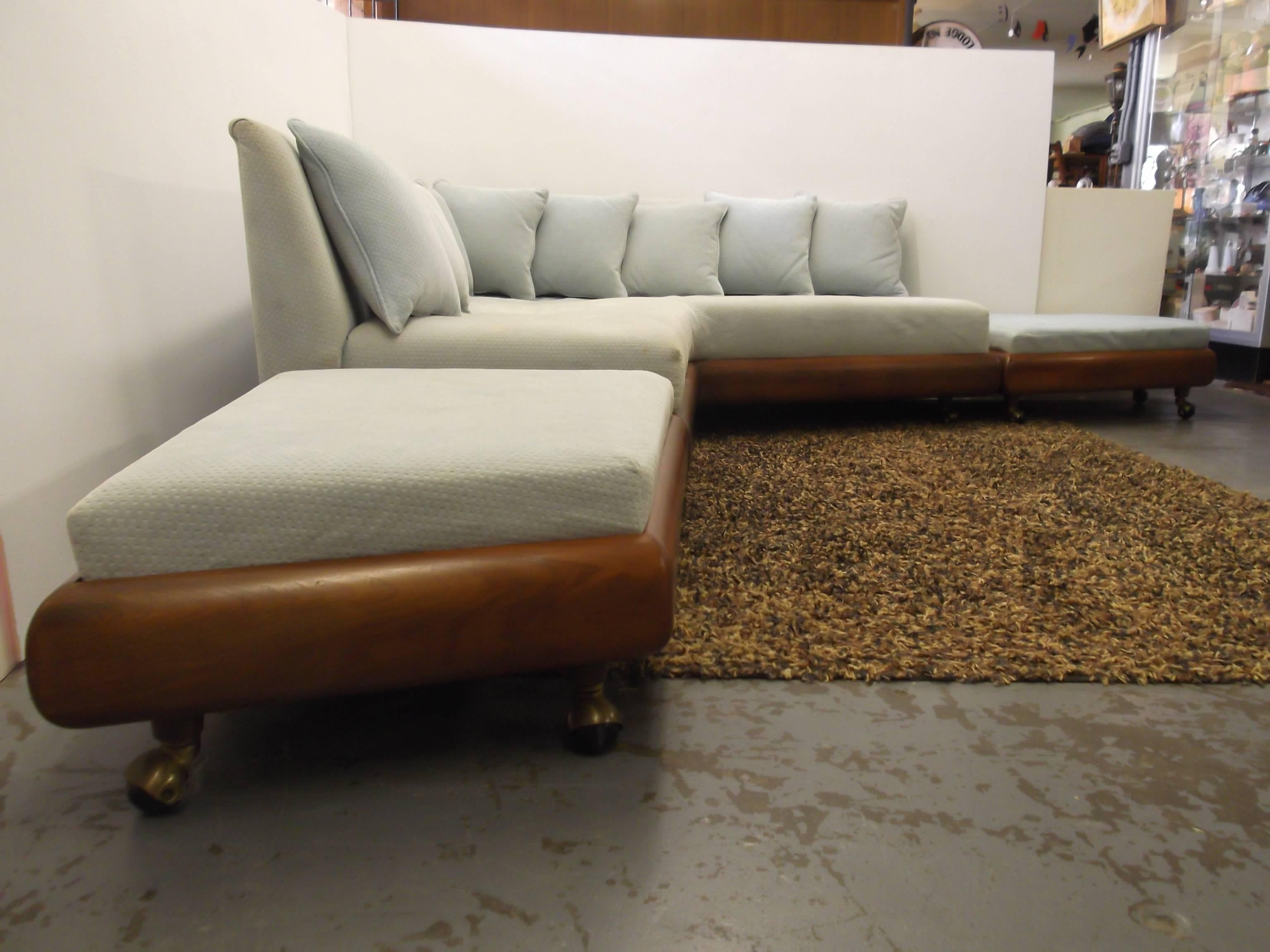 This is one of the coolest Adrian Pearsall sofas out there! It consists of an L-shape sofa, with two floating ottomans that you can configure to the ends to make it a 9+ foot sofa in each direction! All pieces are on casters. The sofa is shaped like