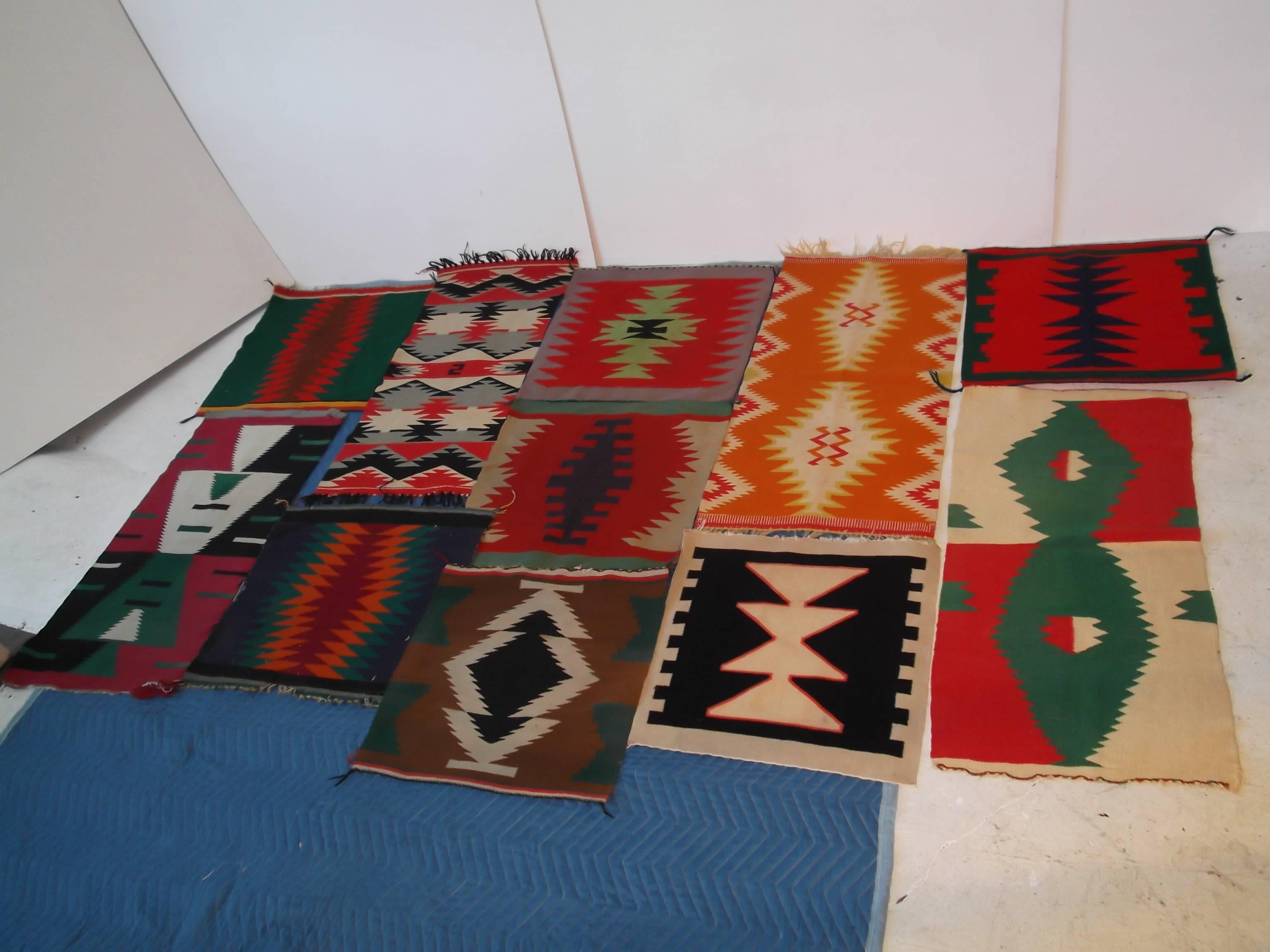 This is an amazing collection of 11 antique Germantown wool, Indian rug samplers. These are authentic Native American. The first pictures are to fronts, and the last picture is the backside to all. There are four elongated, and 7 more squarish