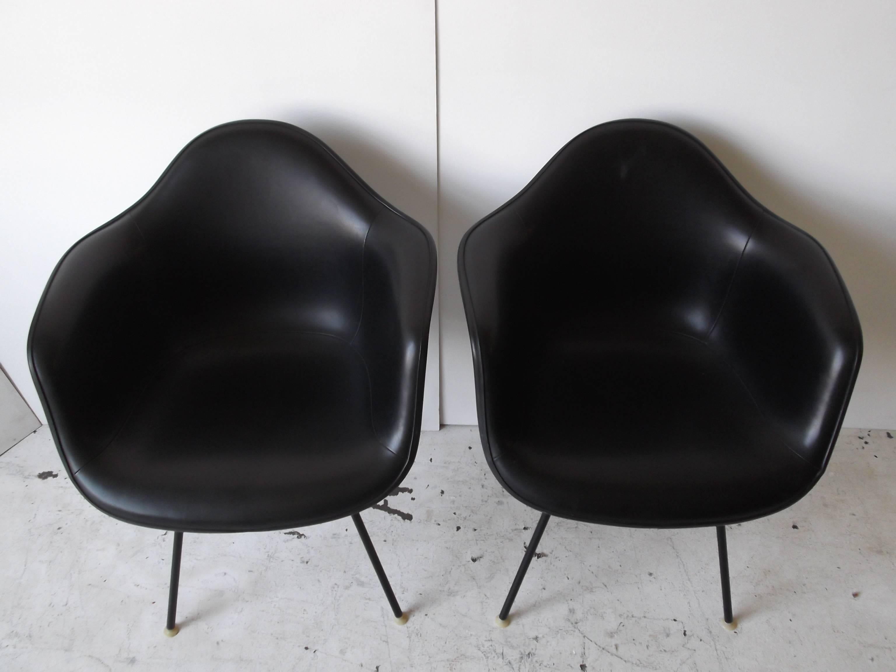 This is a fantastic set of vintage circa 1960s Eames armshells. They have black covers, with black fiberglass, on black legs? Great combo! All the foot glides are present. There are no tears, and the foam is good. They have the 'Circle S