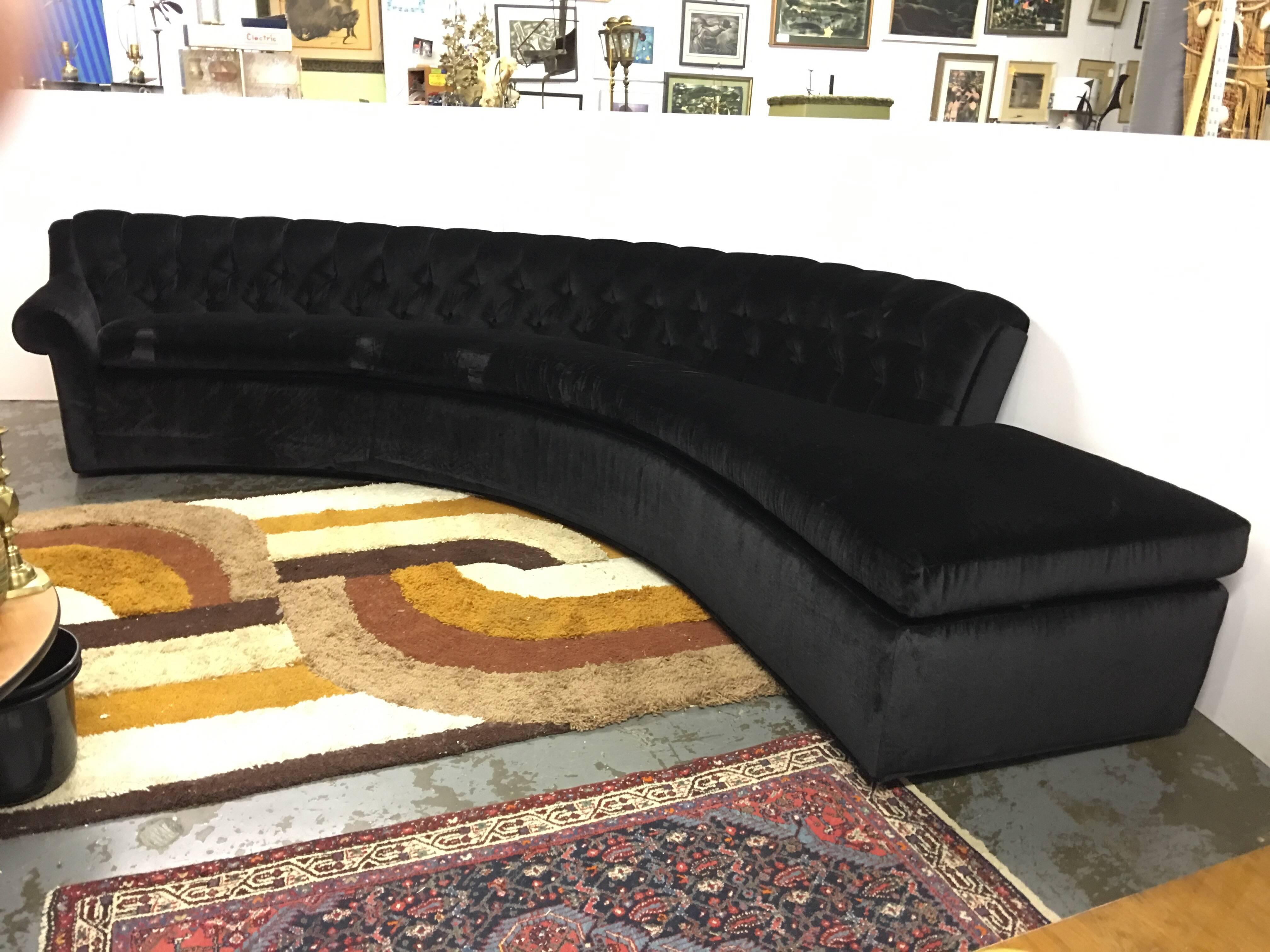 This sofa is amazing. It is curved with a tufted back, all one piece! It is a vintage custom sofa from the 1950s or 1960s era, that has been redone newly in Kelly Wearstler black mohair fabric. It is quite stunning in person. It has a deep seating