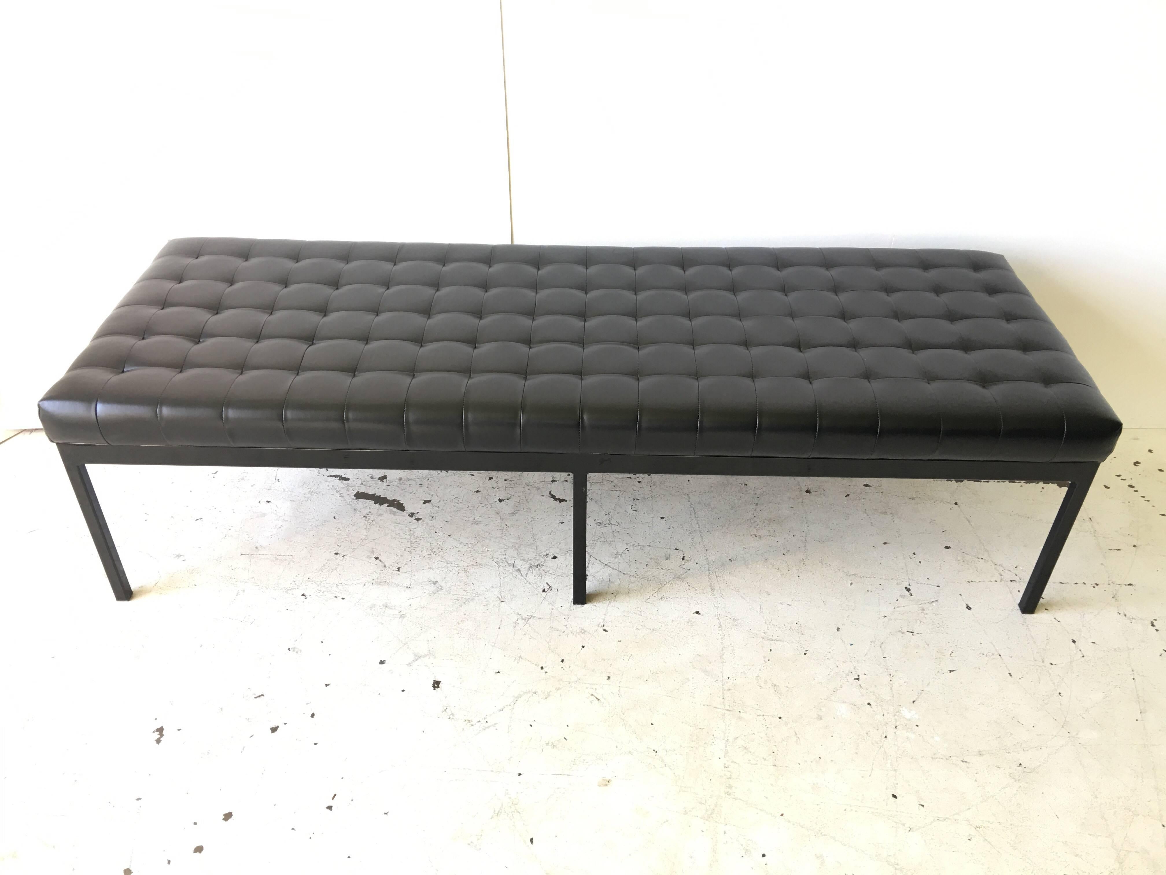 This is a nice square tufted cushion, metal bench. It has painted black base with black vinyl top. It came from a building that had several chrome versions of this pc. by Metropolitan. It is very heavy, and in beautiful condition. These are named