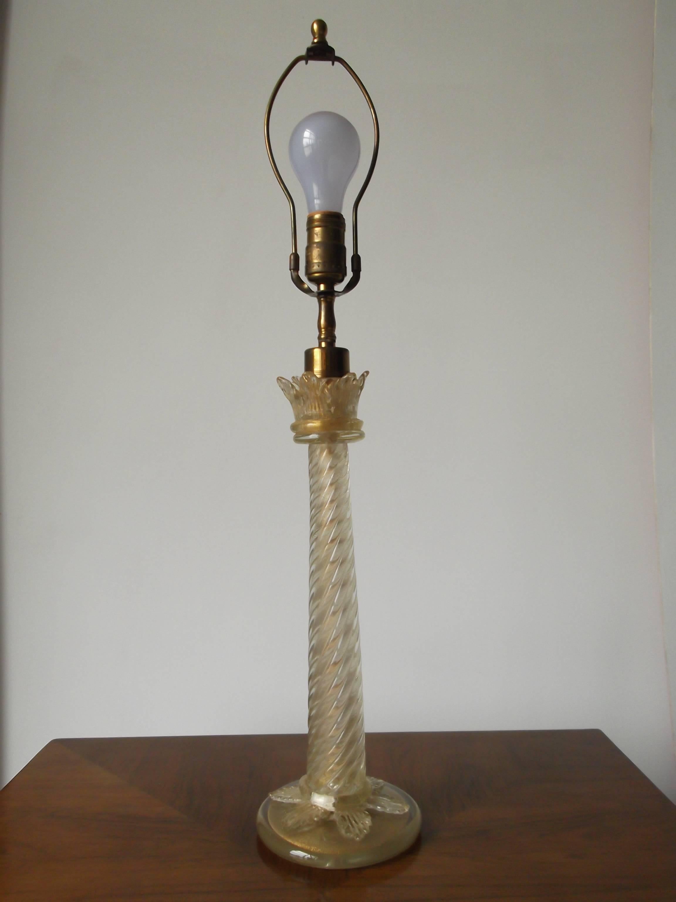 Gorgeous handblown Italian glass table lamp. It is in a candlestick form with leaves to top and on base. Polished bottom with Camer Glass New York, label. Measures 19 3/4