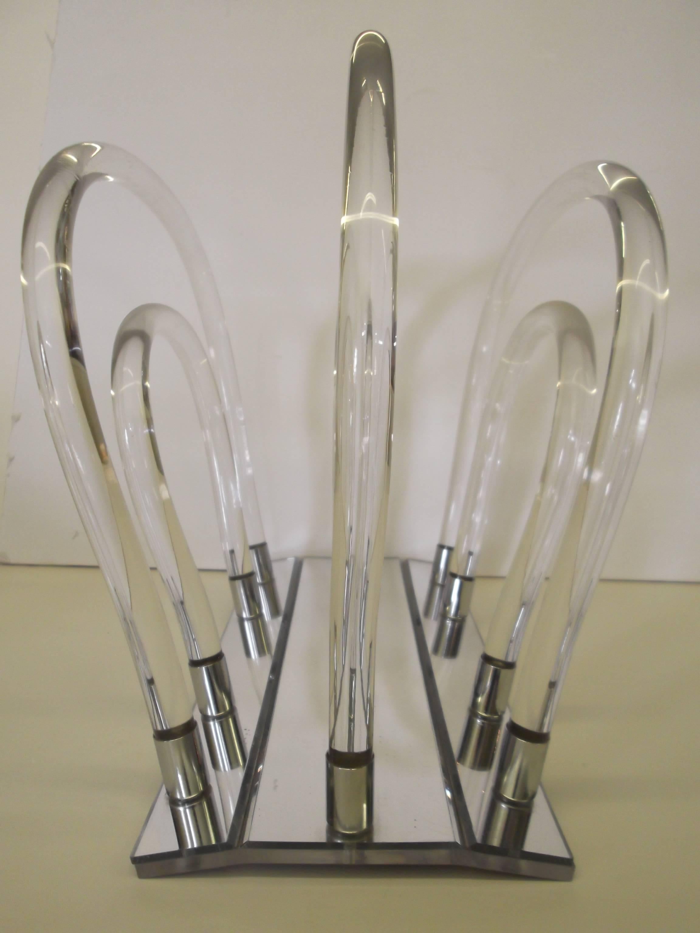 Vintage original, bent Lucite rods, with chrome tips, resting on a mirrored base.