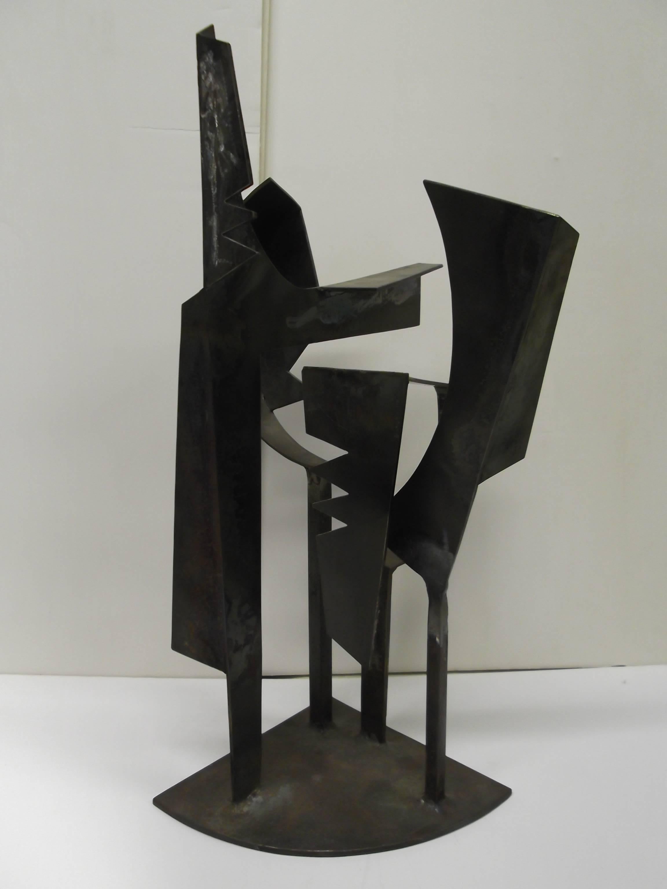 This is a fantastic version of what McVicker envisioned as a string quartet. There are four elements stemming from the base, each with the artists interpretation of musician with instrument. It is welded iron, standing 18