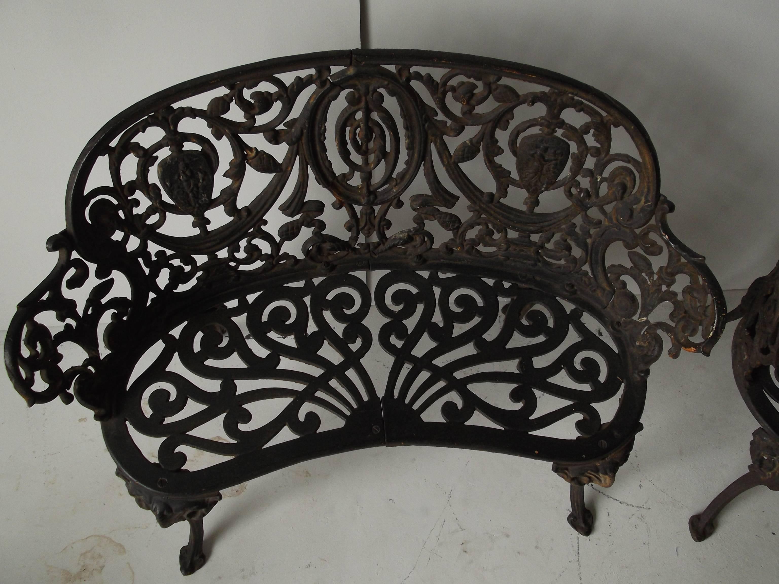 Pair of neoclassical style cast iron garden benches. Orig. garden patina. Feature figural plaques with ornate draping and foliage. Perfect romantic set for your garden or patio. They are a nice smaller size, with the dimensions of one being slightly