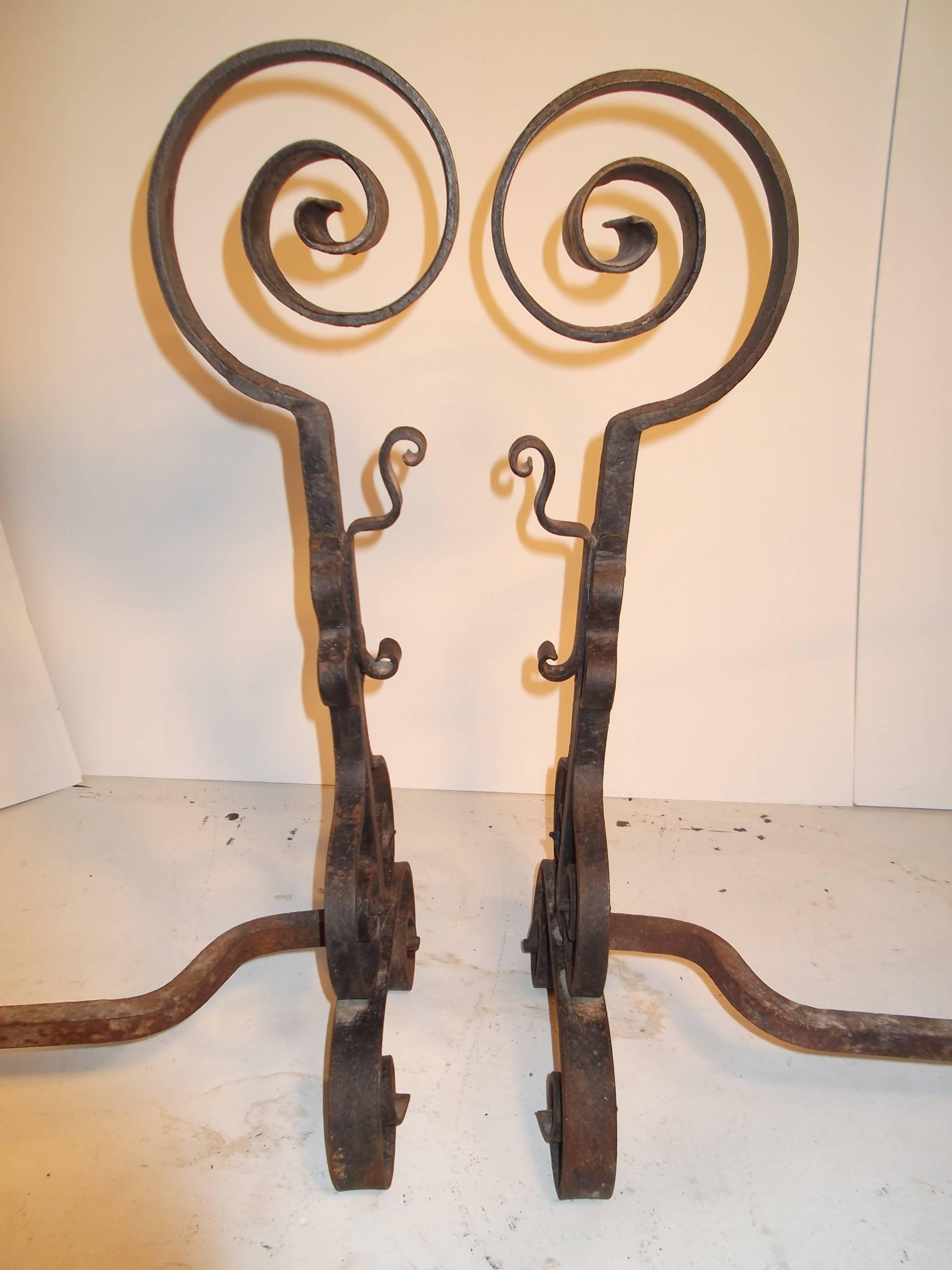 Wonderful antique scrolling andirons, with curly-Q tops, bodies and feet! Large size at 26