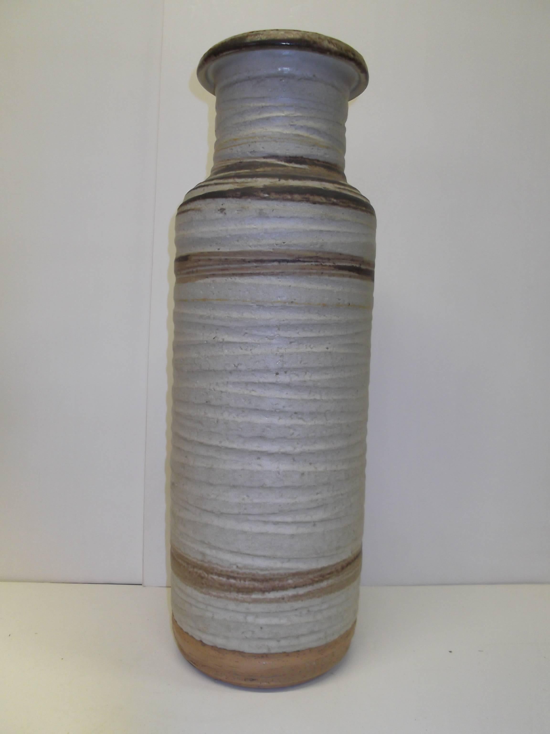This is a nice large size, signed with Rosenthal Netter label, Bitossi Italian pottery vase. It is in natural tones of greys and browns, on natural color clay. There are two small yellow rings as well. It stands a tall 18