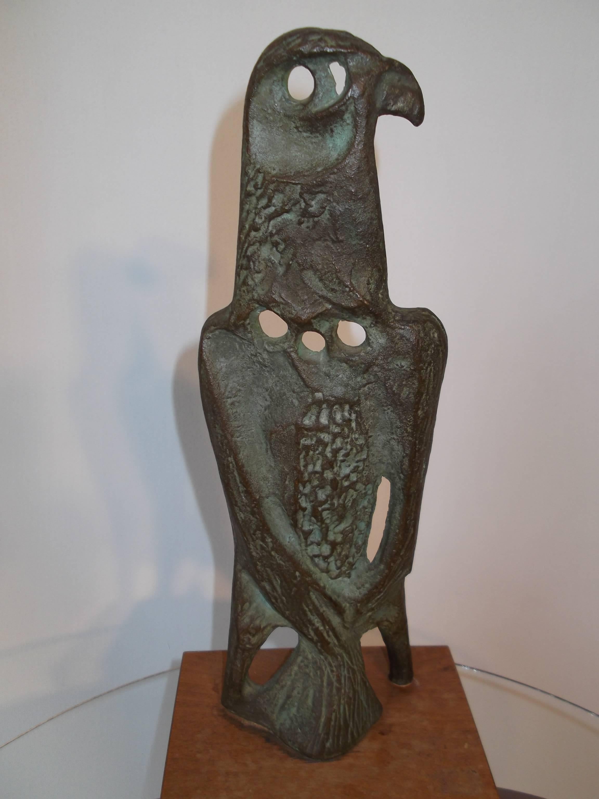 This is an vintage 1950s wonderfully cast bronze sculpture of a falcon or eagle. It is in abstract form, so you be the judge. It has reticulated areas throughout giving it depth, and detail. It is signed by artist Klein to back of wood base in pen.