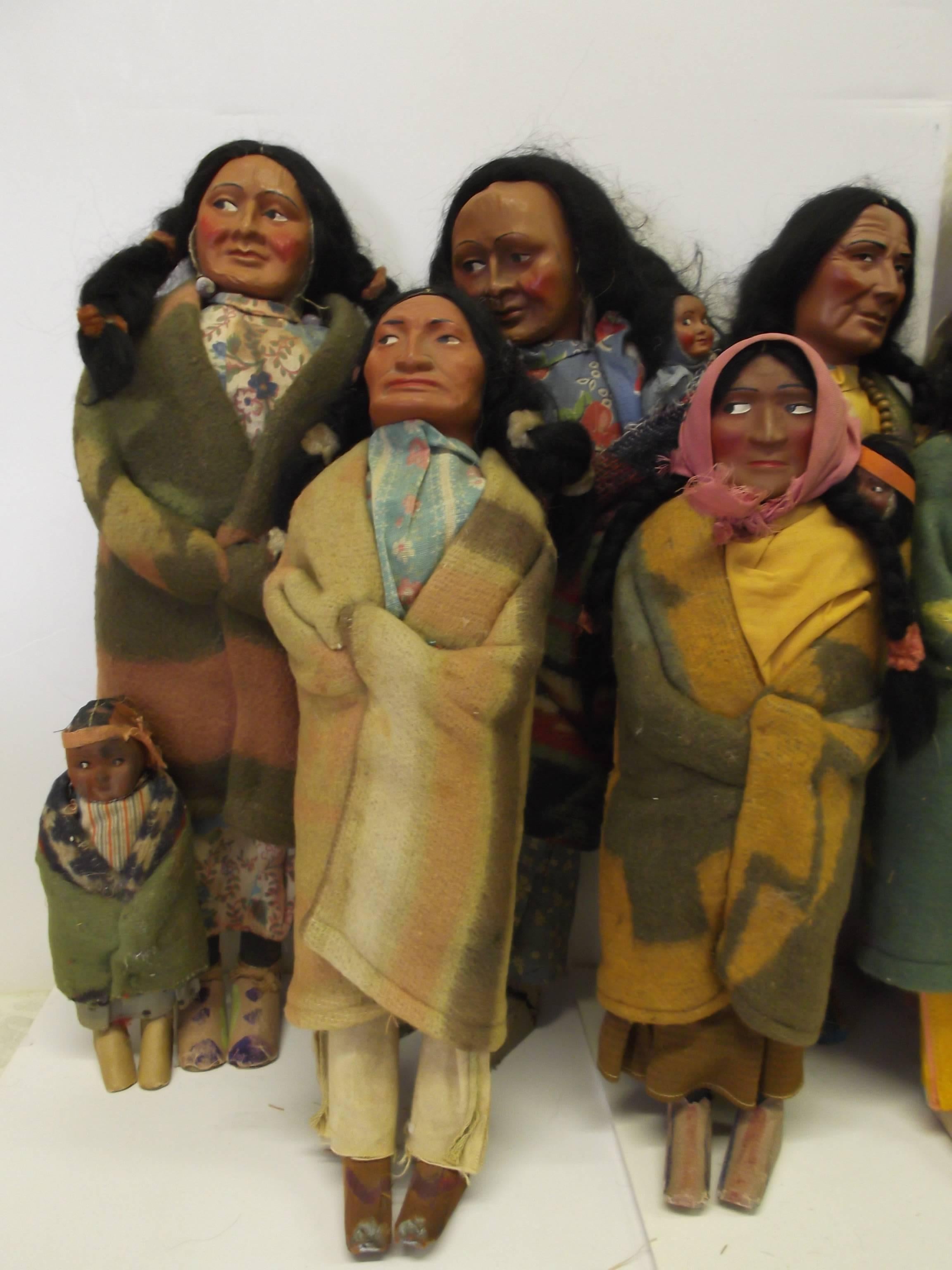 This is a large collection of circa 1915-1940 skookum Indian dolls. There are 15 adults, all but one, over 12