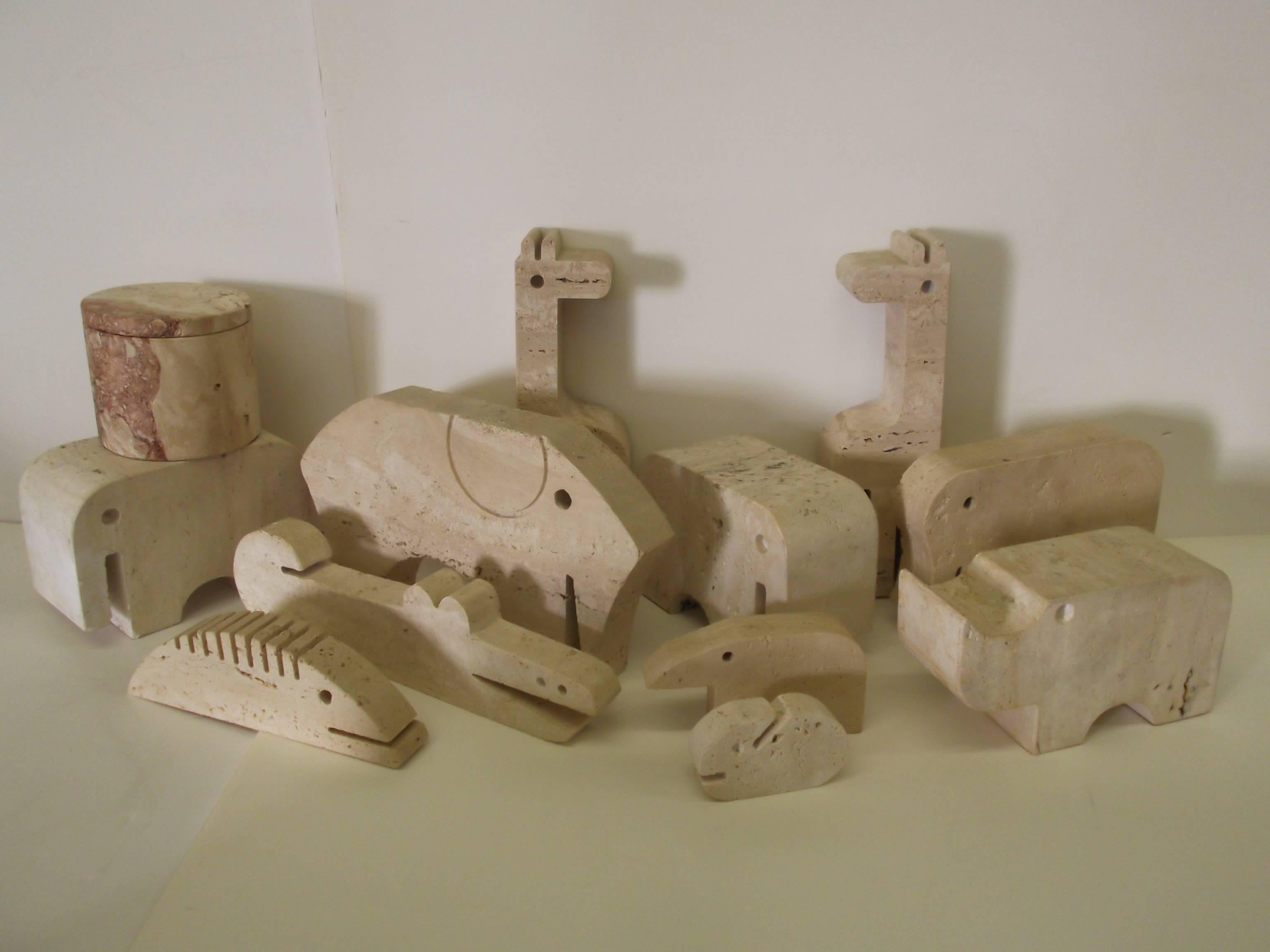 Own the herd! This is a nice collection of F.Lli Mannelli Travertine animals. There are eleven animals, including bookends, and objects, and one circular lidded box. Included are: Two giraffes 3 1/8