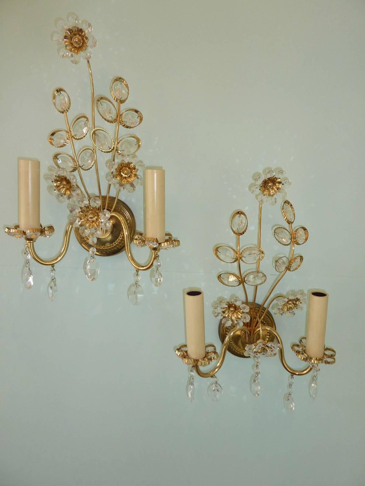 Pair of vintage gold-plated sconces with faceted crystal flowers made by the German company Palwa. Each fixture has two European style E14 sockets. It requires two European E14 candelabra bulbs.